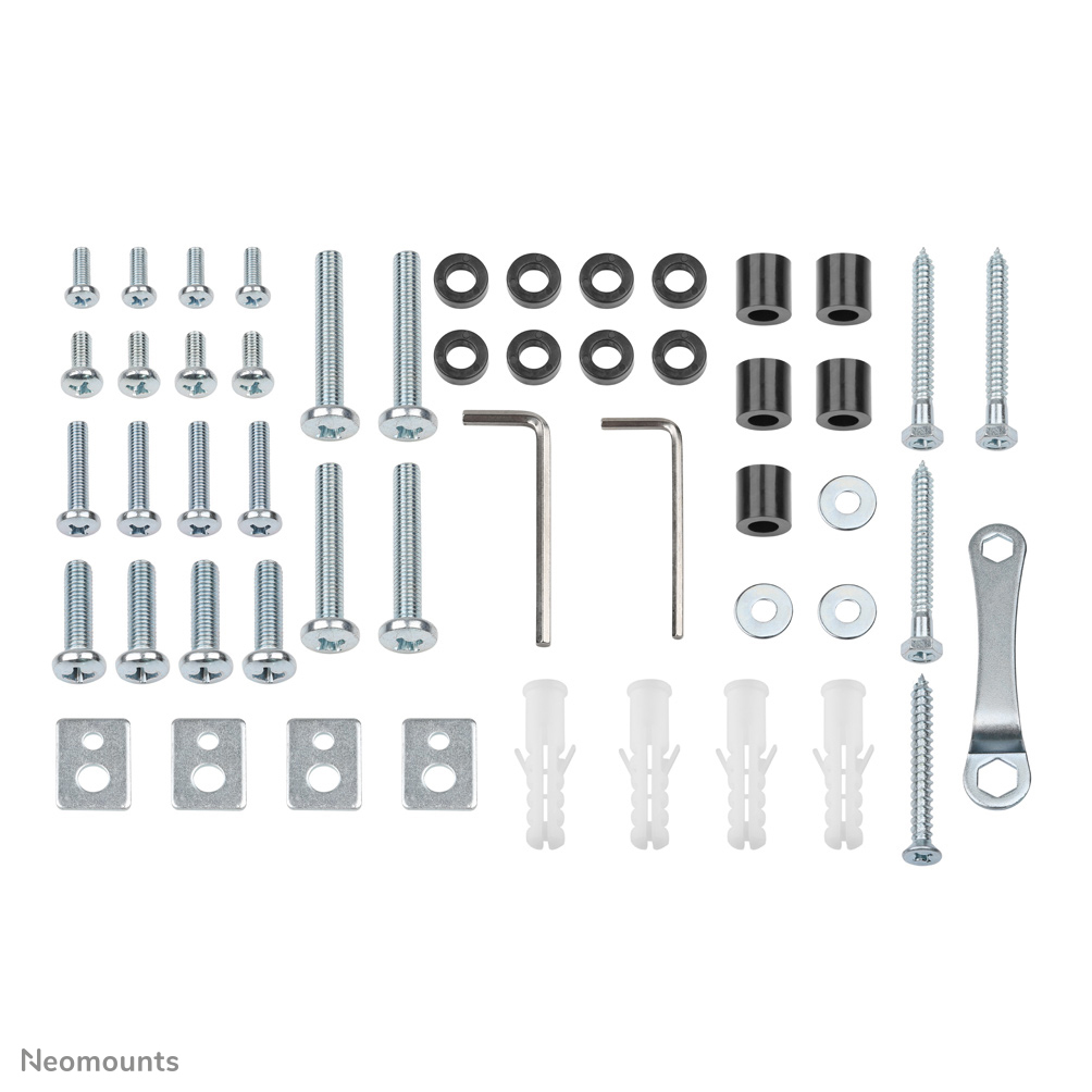 Various screws, washers, and tools arranged neatly on a white surface. Includes Allen wrenches, wall plugs, and metal brackets.