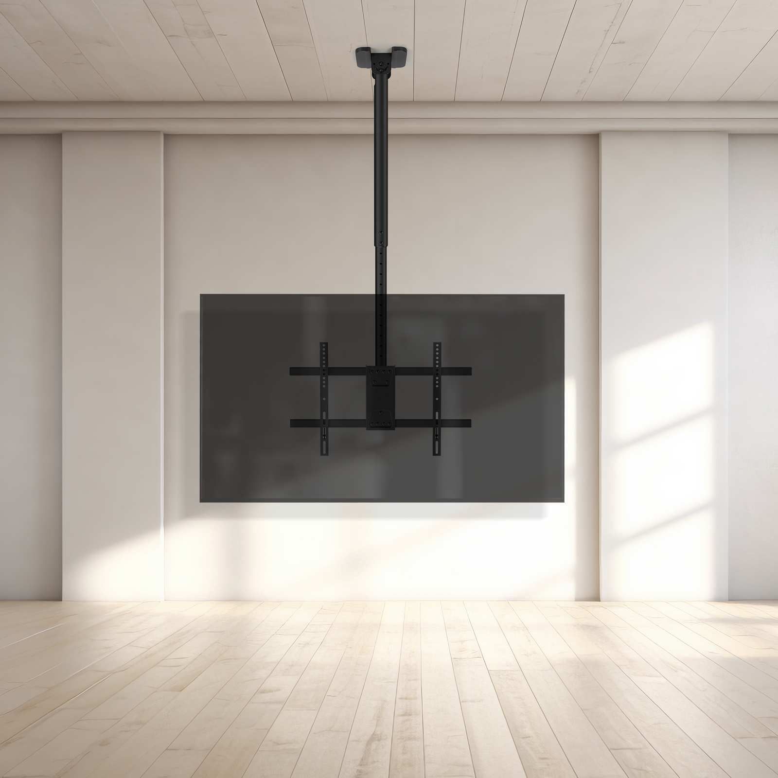 Un soporte de TV negro montado en el techo está instalado. Una pantalla de TV oscura está montada en la pared.