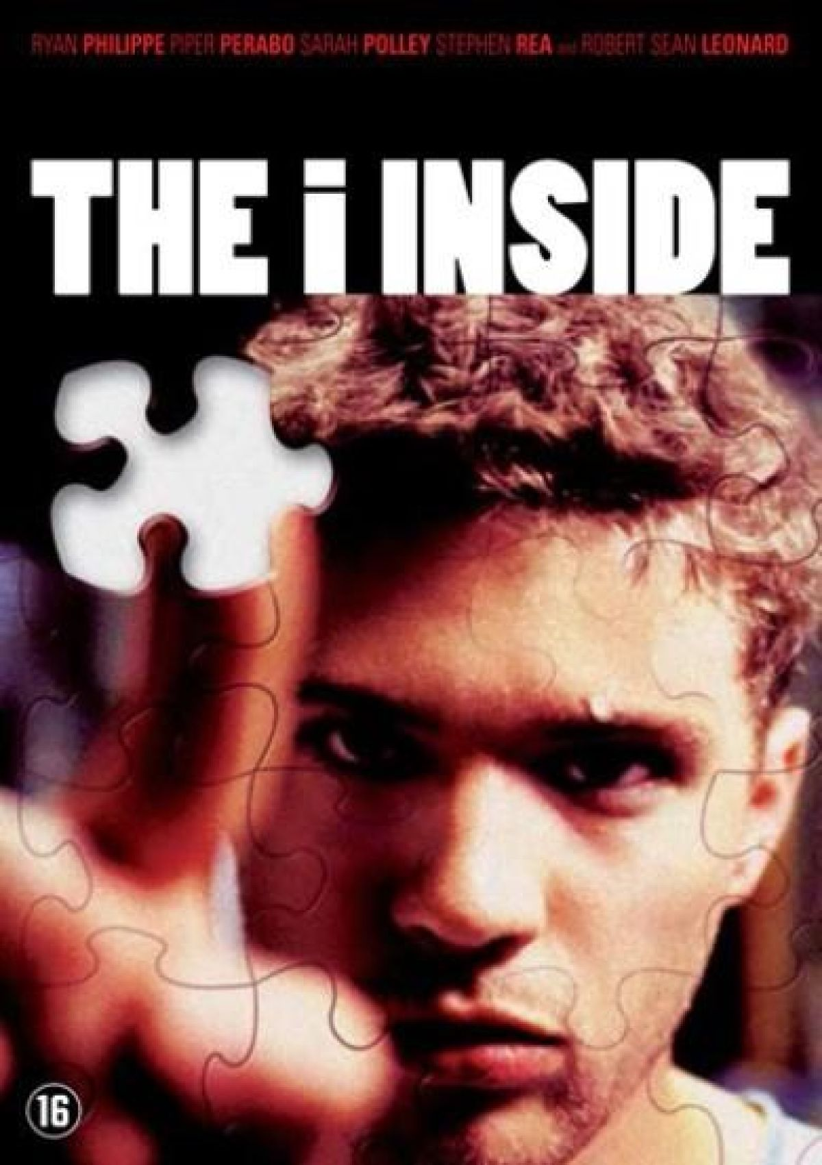 Filmposter: gezicht van een man met puzzelstukjes. Titel 'The I Inside'. Namen van acteurs bovenaan en leeftijdsclassificatie onderaan.