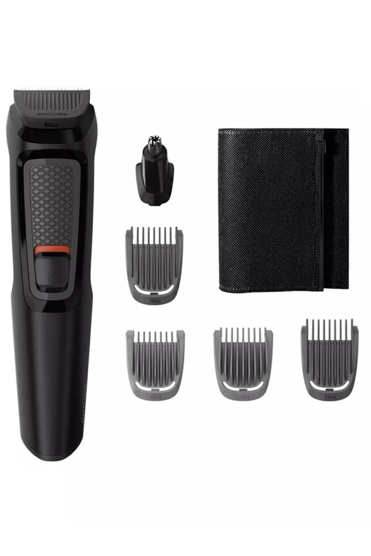 Siyah Philips multi-groomer seti. Ana ünite, düzeltici başlıklar, burun düzeltici ve siyah saklama çantası içerir.