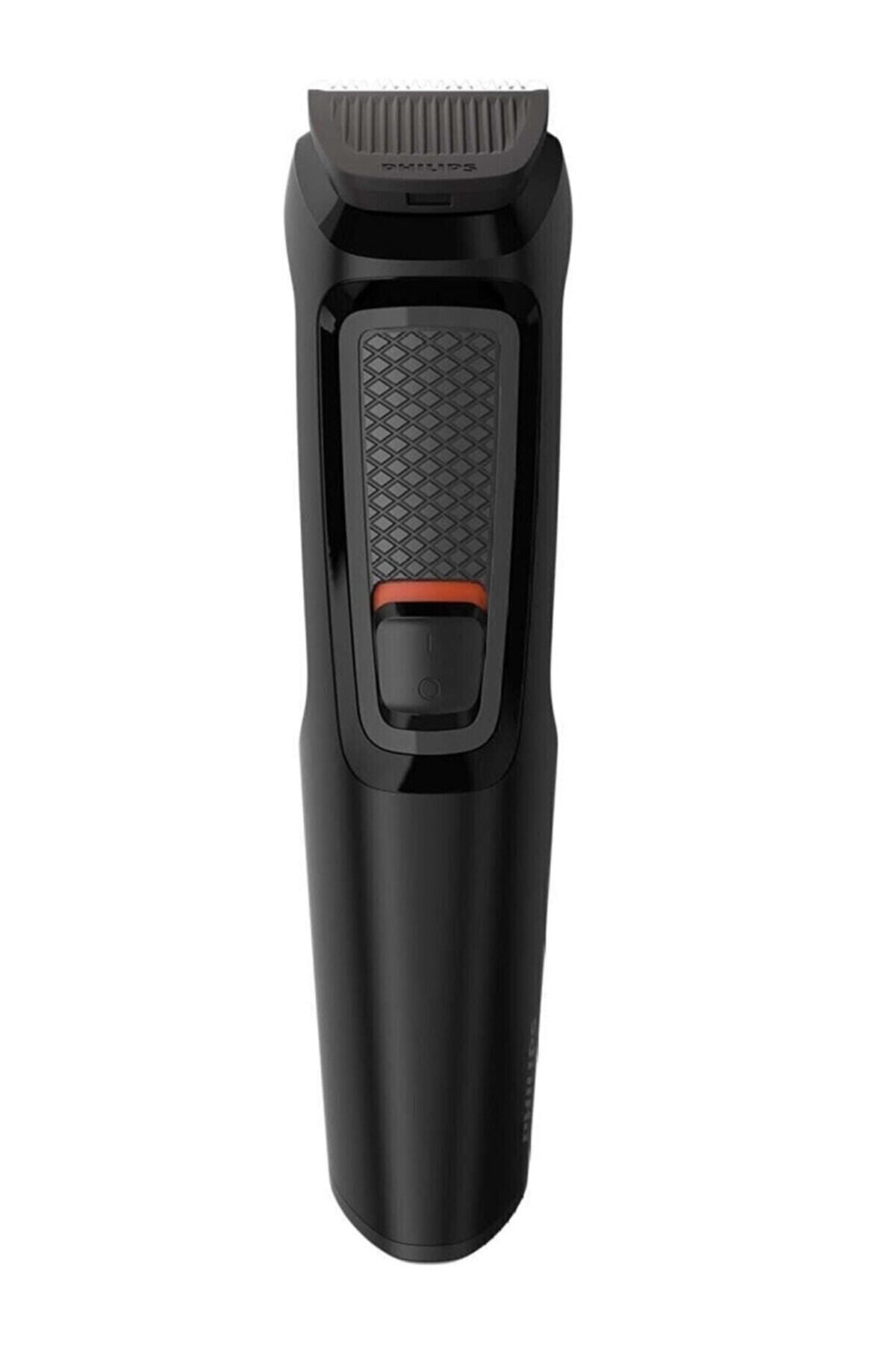 Siyah bir Philips multi-groomer. Desenli bir tutamağı olan siyah bir gövdesi vardır. Turuncu bir güç düğmesi var.