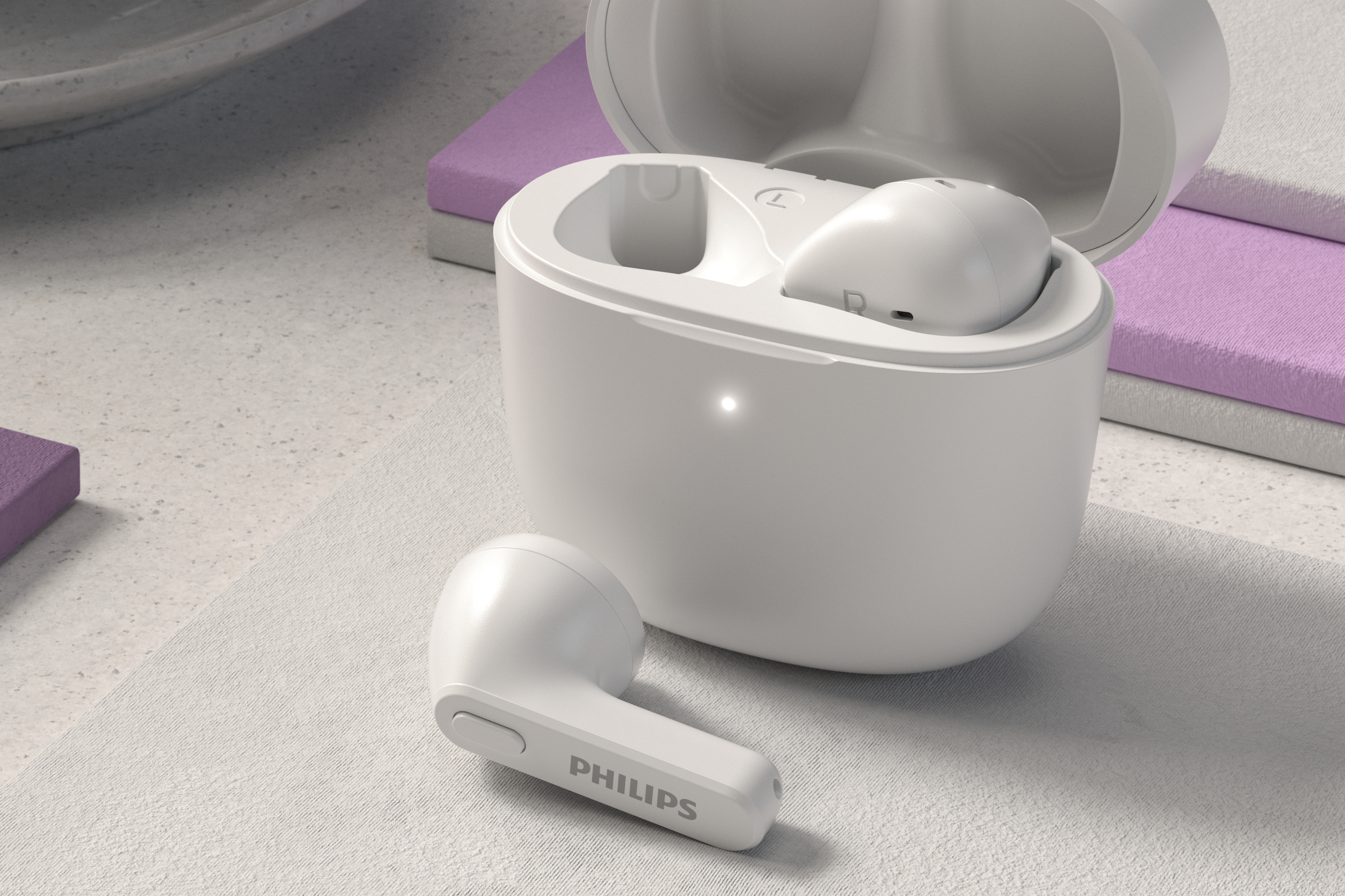 Auriculares y estuche de carga Philips blancos sobre una superficie texturizada. El estuche está abierto, con un auricular dentro.