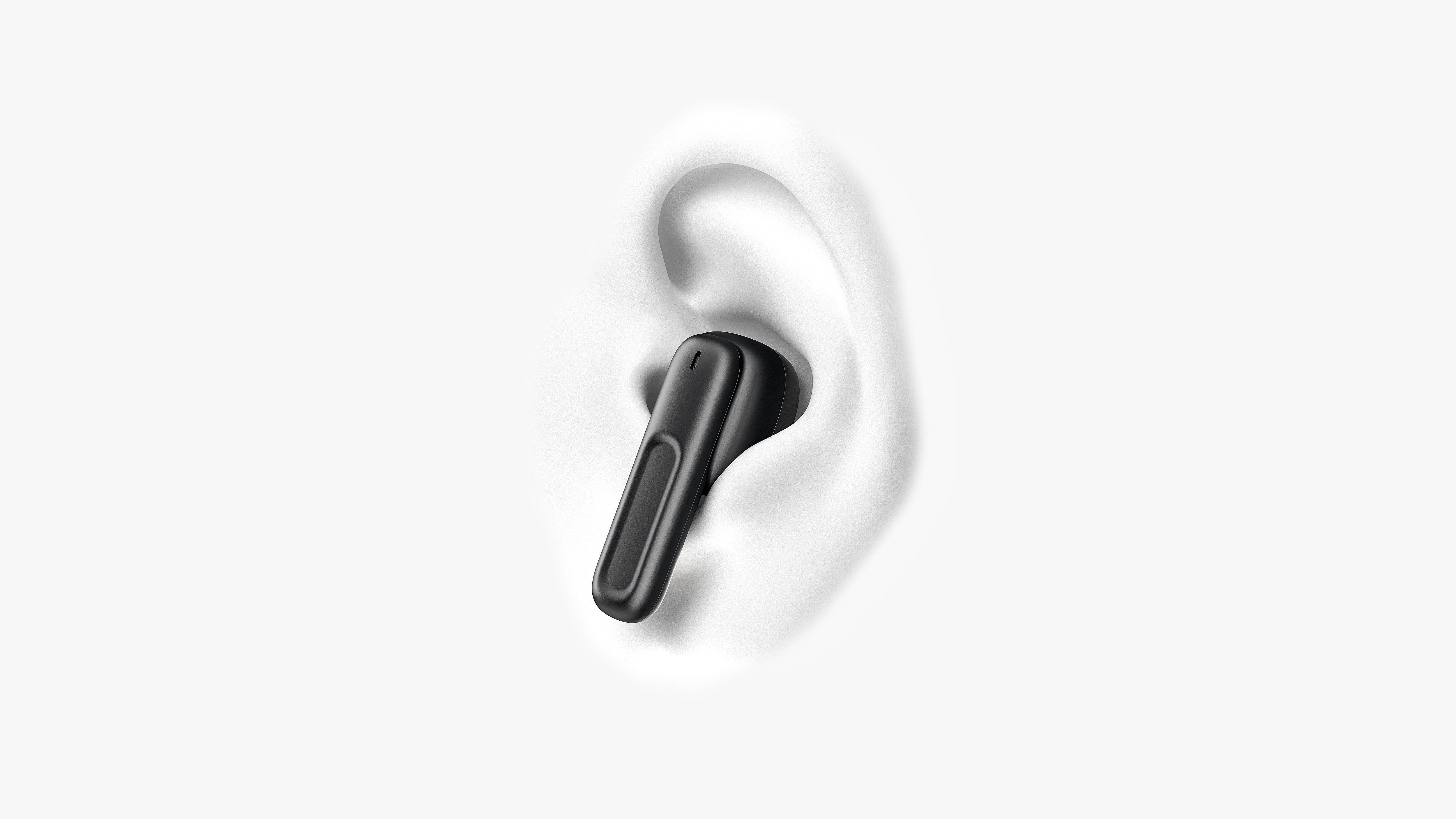 Un auricolare nero è inserito in un orecchio bianco. Lo sfondo è bianco semplice.