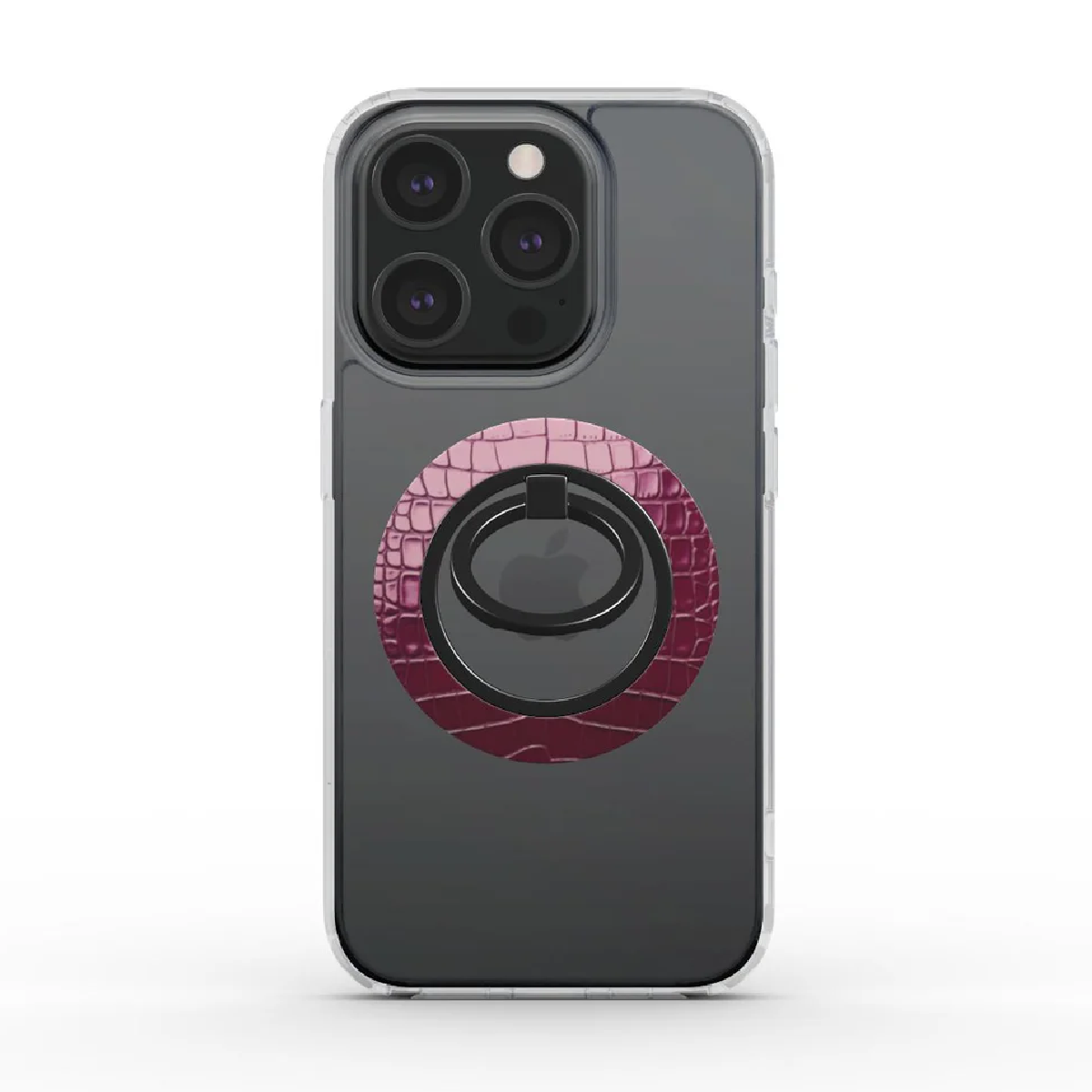 iPhone con custodia trasparente. Ha un porta anello rosa con motivo a coccodrillo. L'anello è nero, con un logo Apple. Il telefono ha un retro grigio scuro.