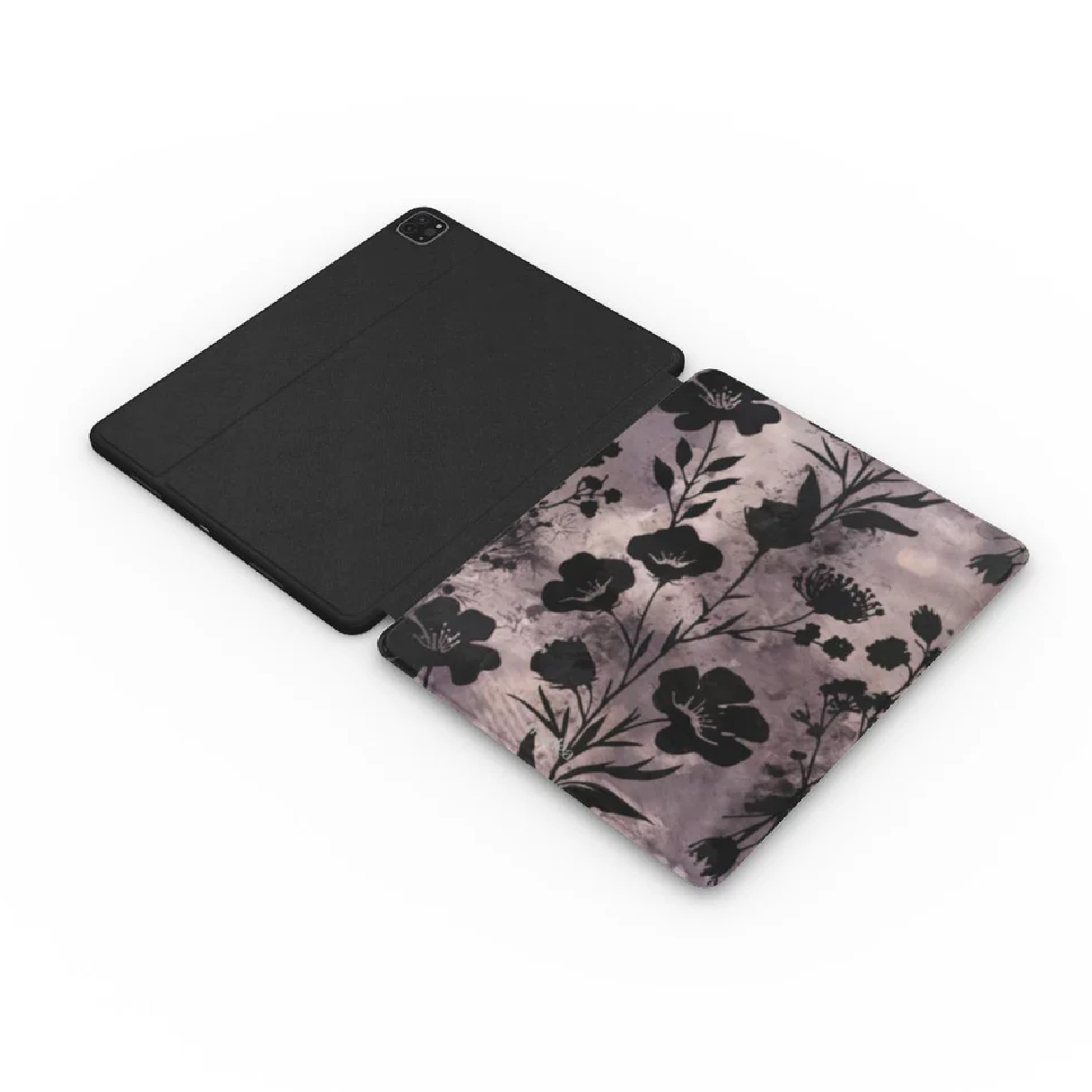 Custodia per tablet nera, aperta per rivelare un motivo floreale all'interno. Il motivo presenta fiori e foglie nere su uno sfondo attenuato.