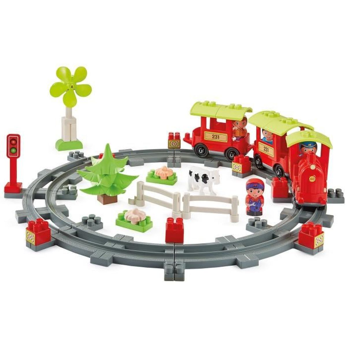 Un set di trenini giocattolo con un binario circolare. Include un treno rosso, figurine, una mucca, alberi, recinzioni e una turbina eolica.