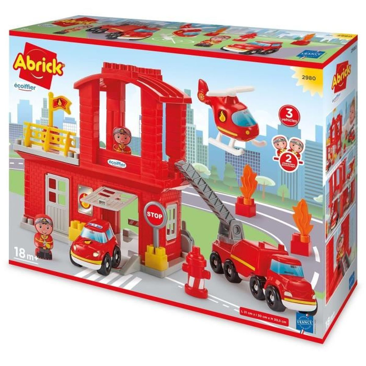 Un set di autopompe giocattolo. Include un edificio rosso della stazione dei pompieri, un elicottero, un'autopompa e delle figure. La scatola ha un logo Abrick.