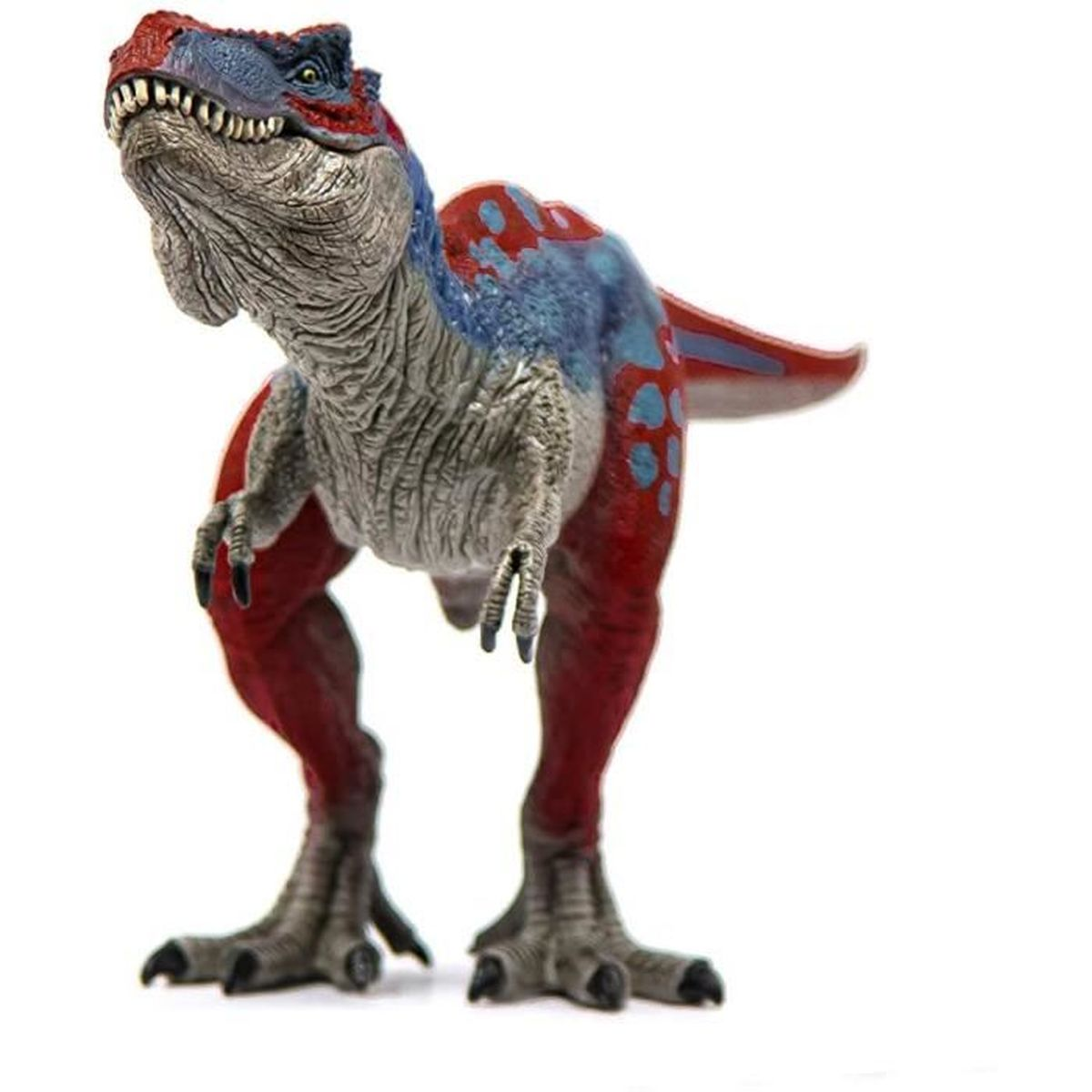 Un giocattolo a forma di dinosauro, zampe rosse, schiena blu e rossa, testa grigia. È su sfondo bianco.