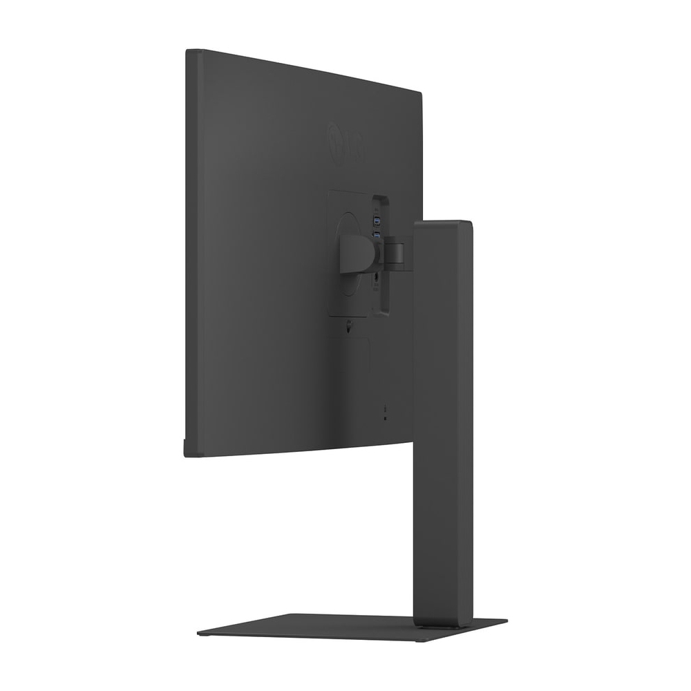 Ciemnoszary monitor komputera jest pokazany od tyłu. Monitor ma podstawę i jest ustawiony na białym tle.