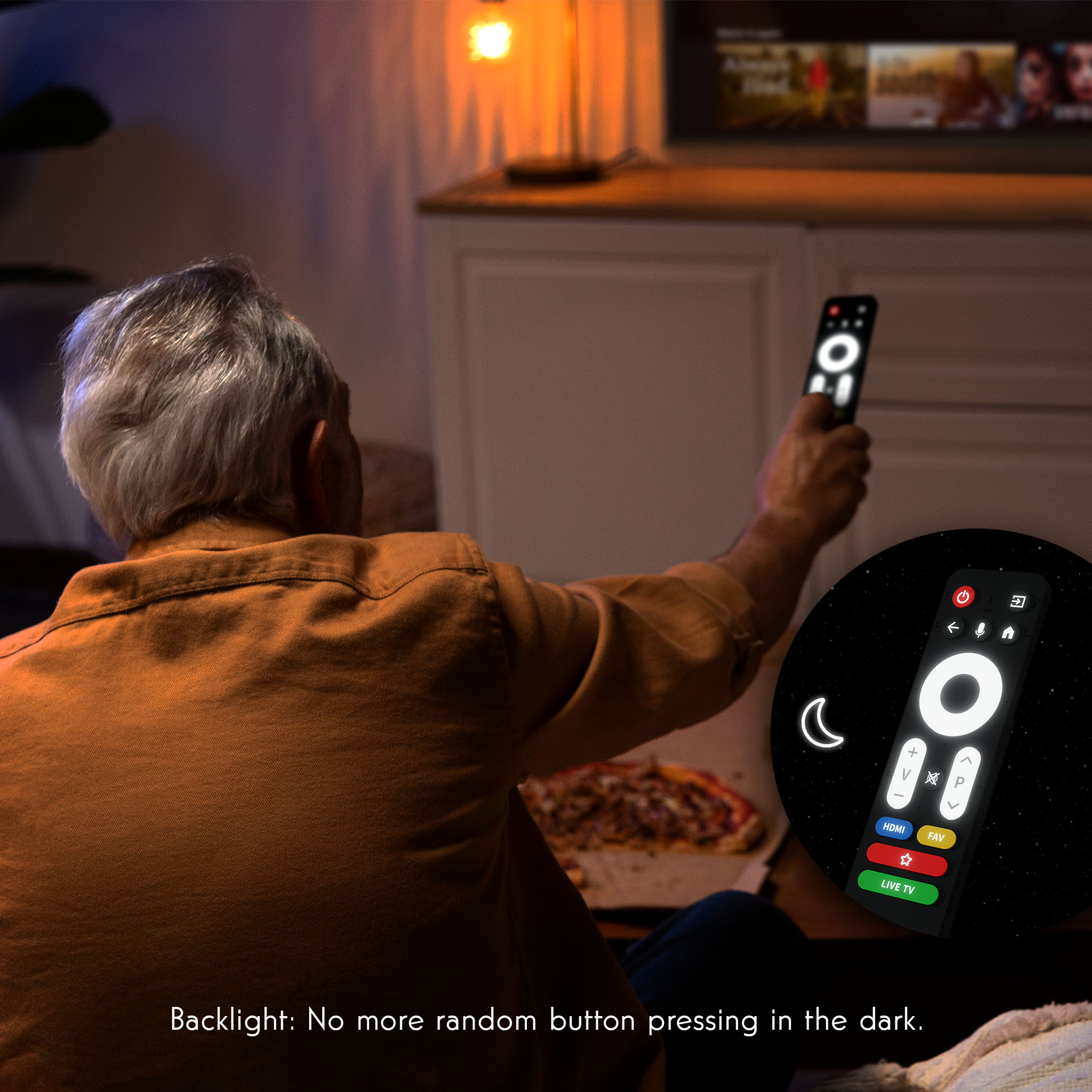 A person using a remote control in a dim room. A TV is in the background. The remote has a backlight.