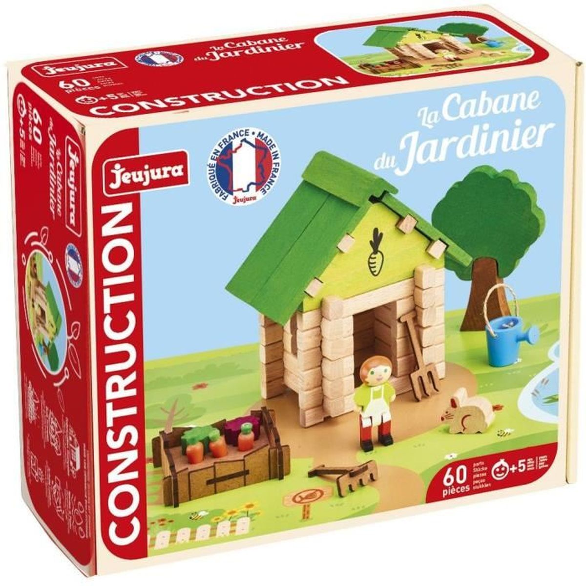 Una scatola di giocattoli da costruzione. Mostra una casa di legno, una figura di giardiniere, un coniglio e attrezzi da giardinaggio. La scatola dice 'La Cabane du Jardinier'.