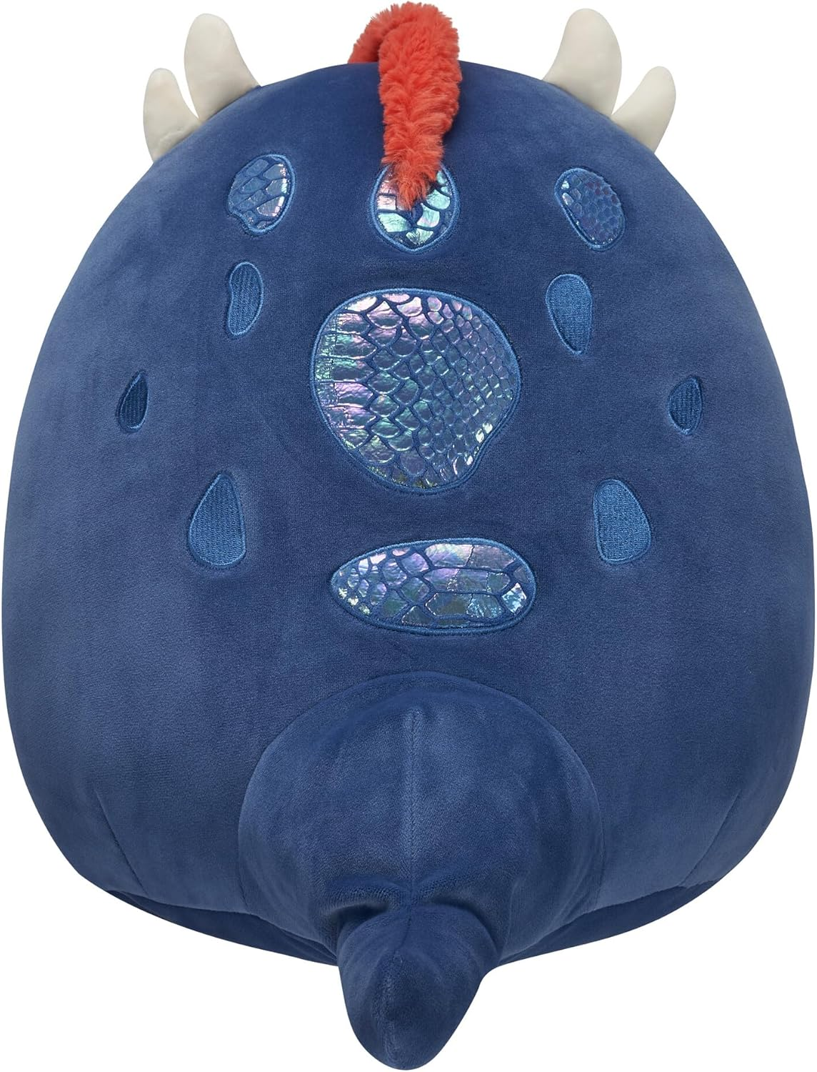Un jouet dinosaure en peluche bleu avec des cornes blanches, une crête orange et des écailles irisées sur le dos.
