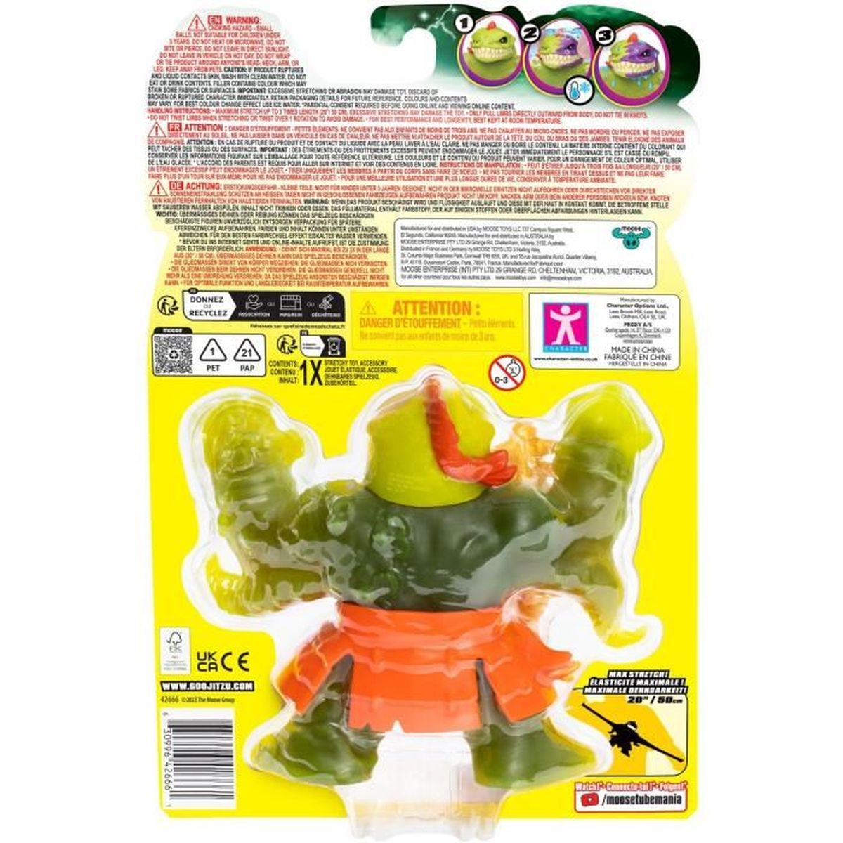 Grüne, dehnbare Spielfigur mit orangefarbenen Shorts, rotem Kopfschmuck und gelber Verpackung.