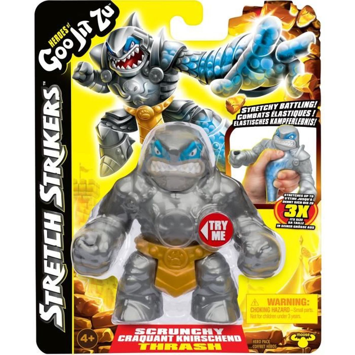 Verpackung einer Spielfigur. Die Figur ist grau mit goldenem Gürtel und blauem Gesicht. Hintergrund zeigt andere Figuren und Text.