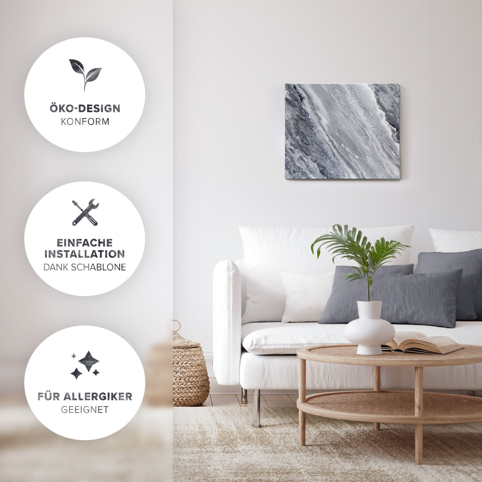 Ein Wohnzimmer mit einem Marmorkunstwerk, weißem Sofa, Kissen und einem Holztisch mit einer Pflanze und einem Buch.