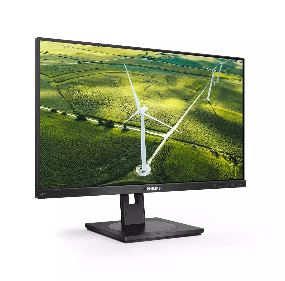 Un monitor Philips mostra un campo verde con turbine eoliche. Il monitor è nero con un supporto nero. Il marchio è visibile.