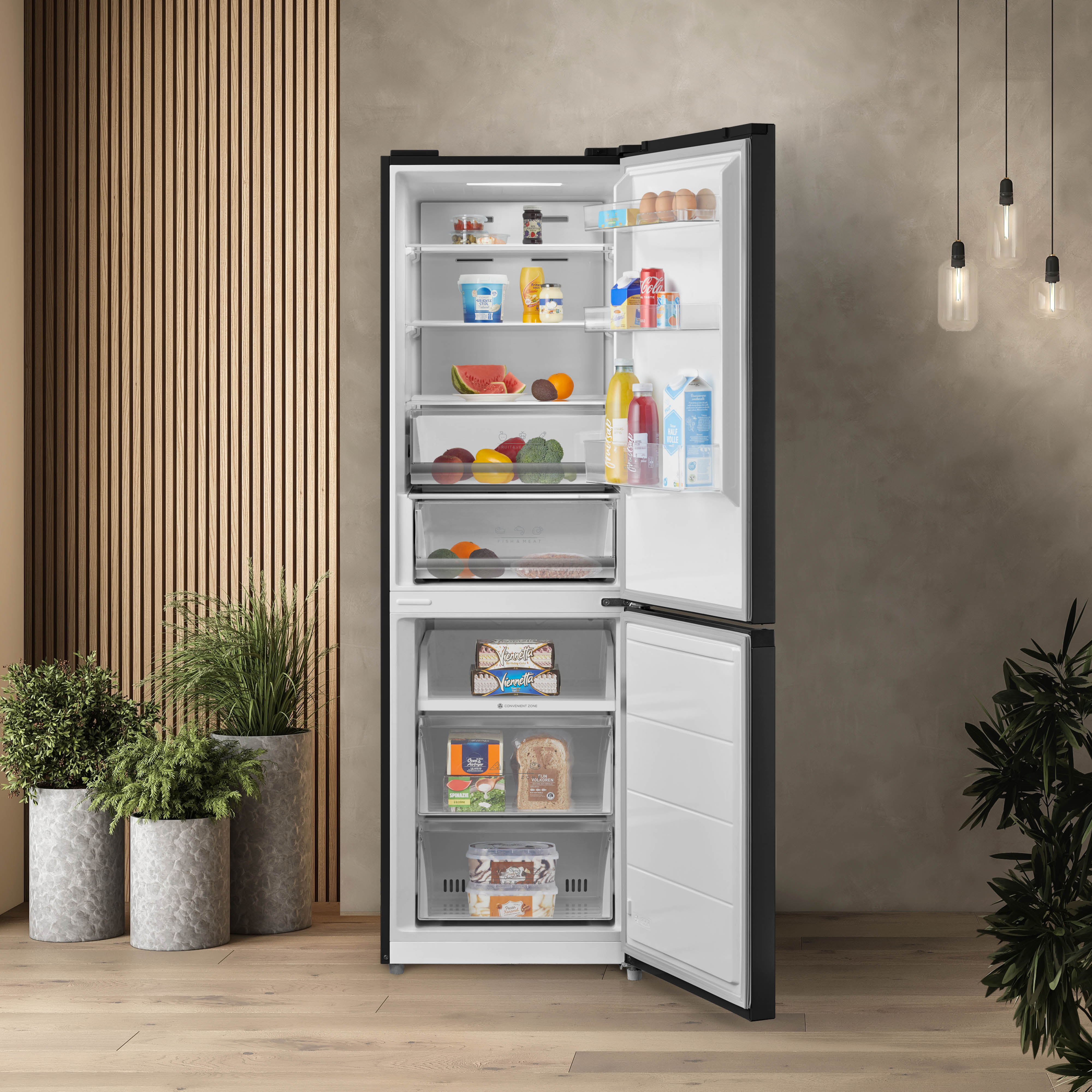 Open fridge with food inside. Wall decor and plants are in the background.