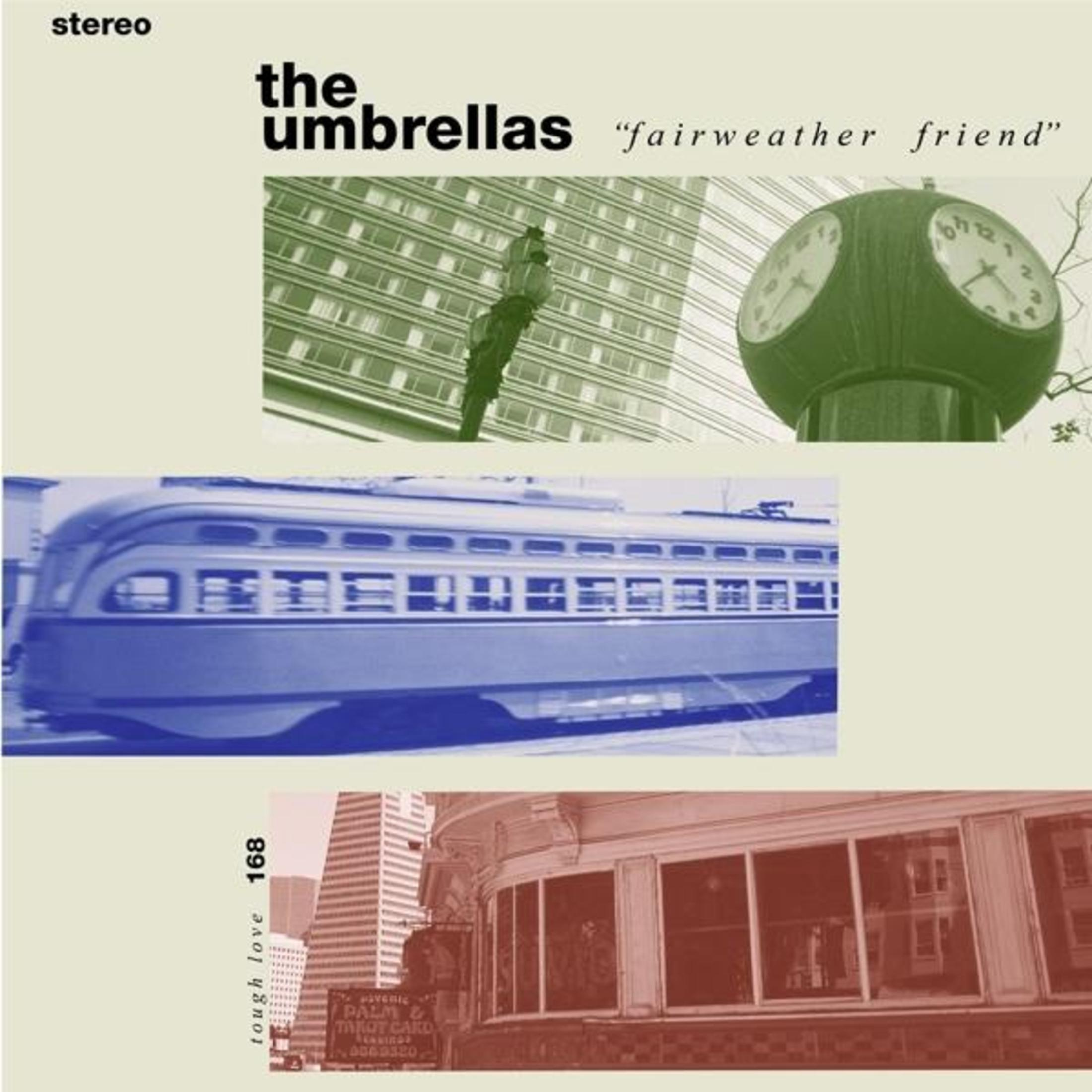 Copertina dell'album con testo 'the umbrellas', immagini di un orologio, edifici, un tram e una tavola calda.