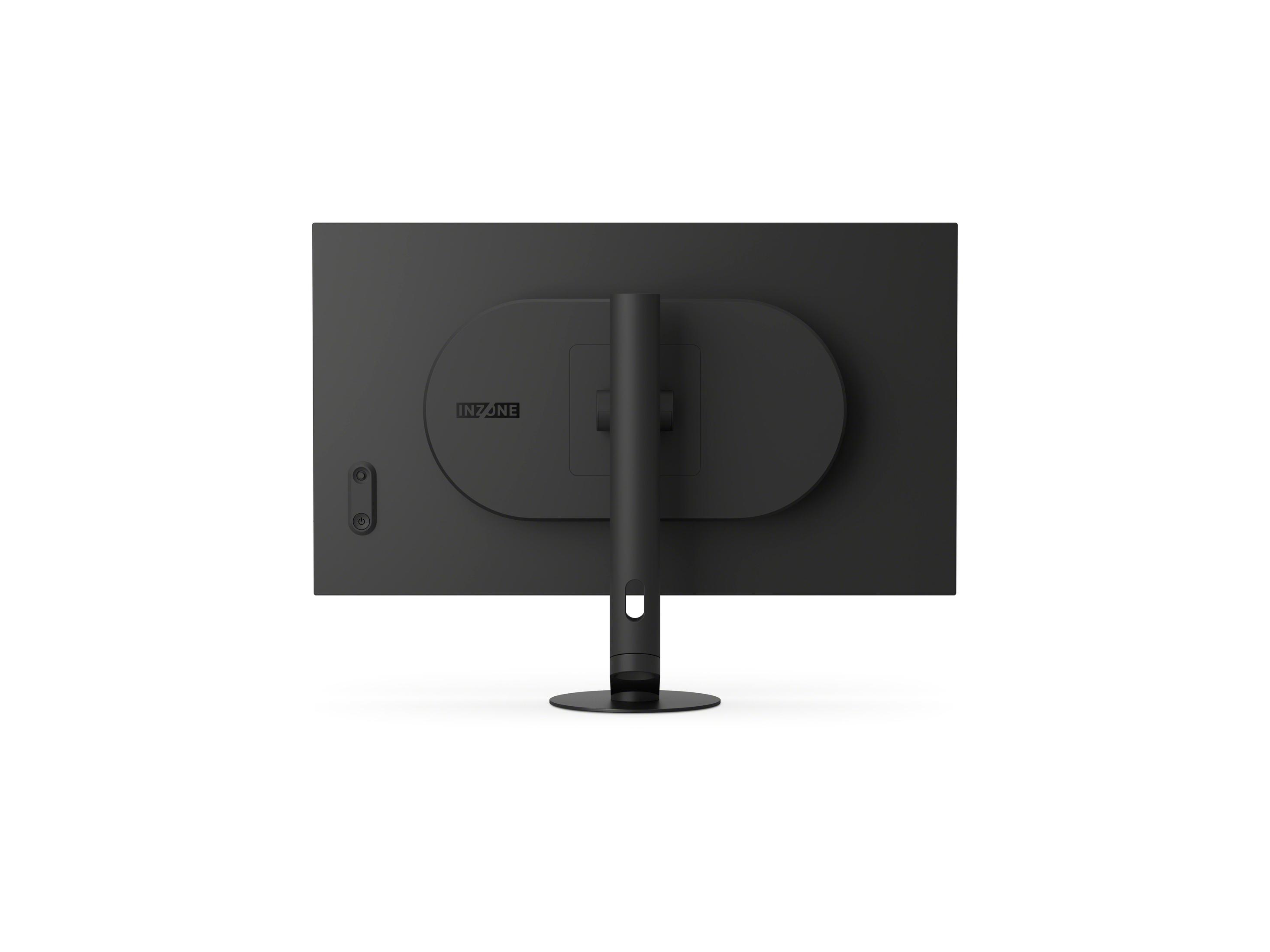 La parte trasera de un monitor de computadora negro. El soporte es un cilindro negro. El monitor tiene el logotipo de INZONE.