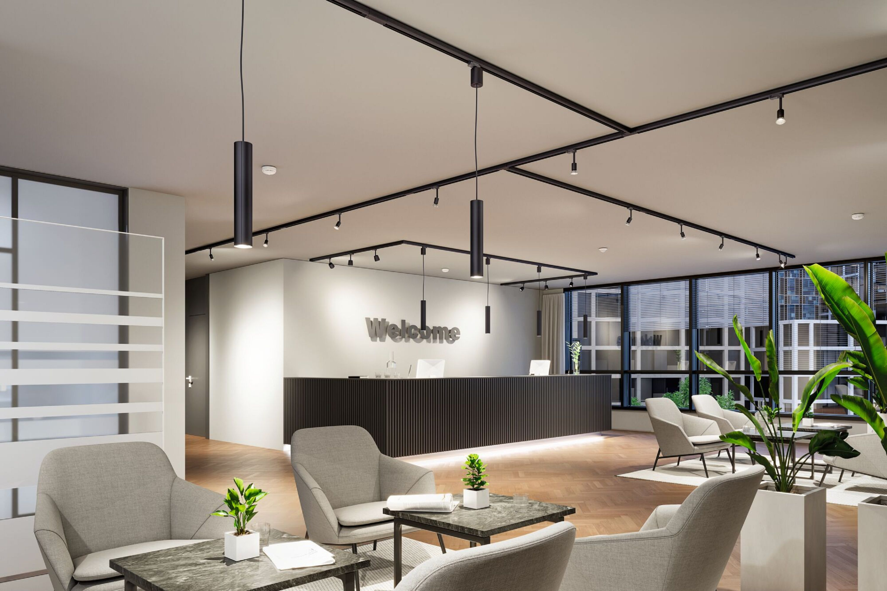 Ein Büroeingangsbereich mit grauen Stühlen, Pflanzen und einem Willkommensschild. Der Boden hat ein Holzmuster.
