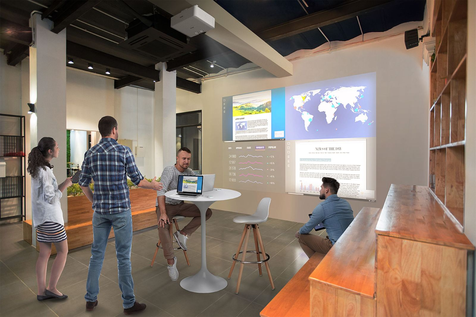 Grupa osób w nowoczesnym biurze. Ekrany pokazują wiadomości, wykresy i mapę świata. Jedna osoba używa laptopa.