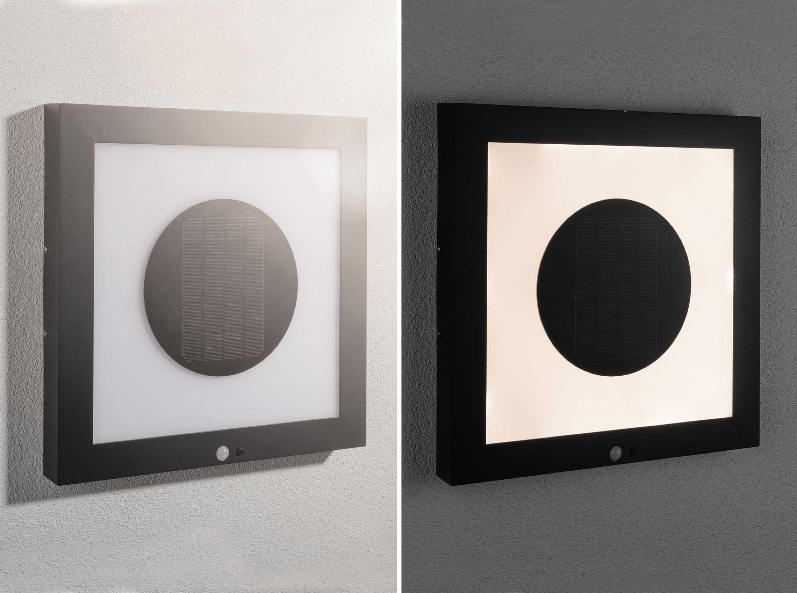 Zwei quadratische Lichter mit schwarzem Rahmen und schwarzem Kreis in der Mitte an einer weißen Wand.