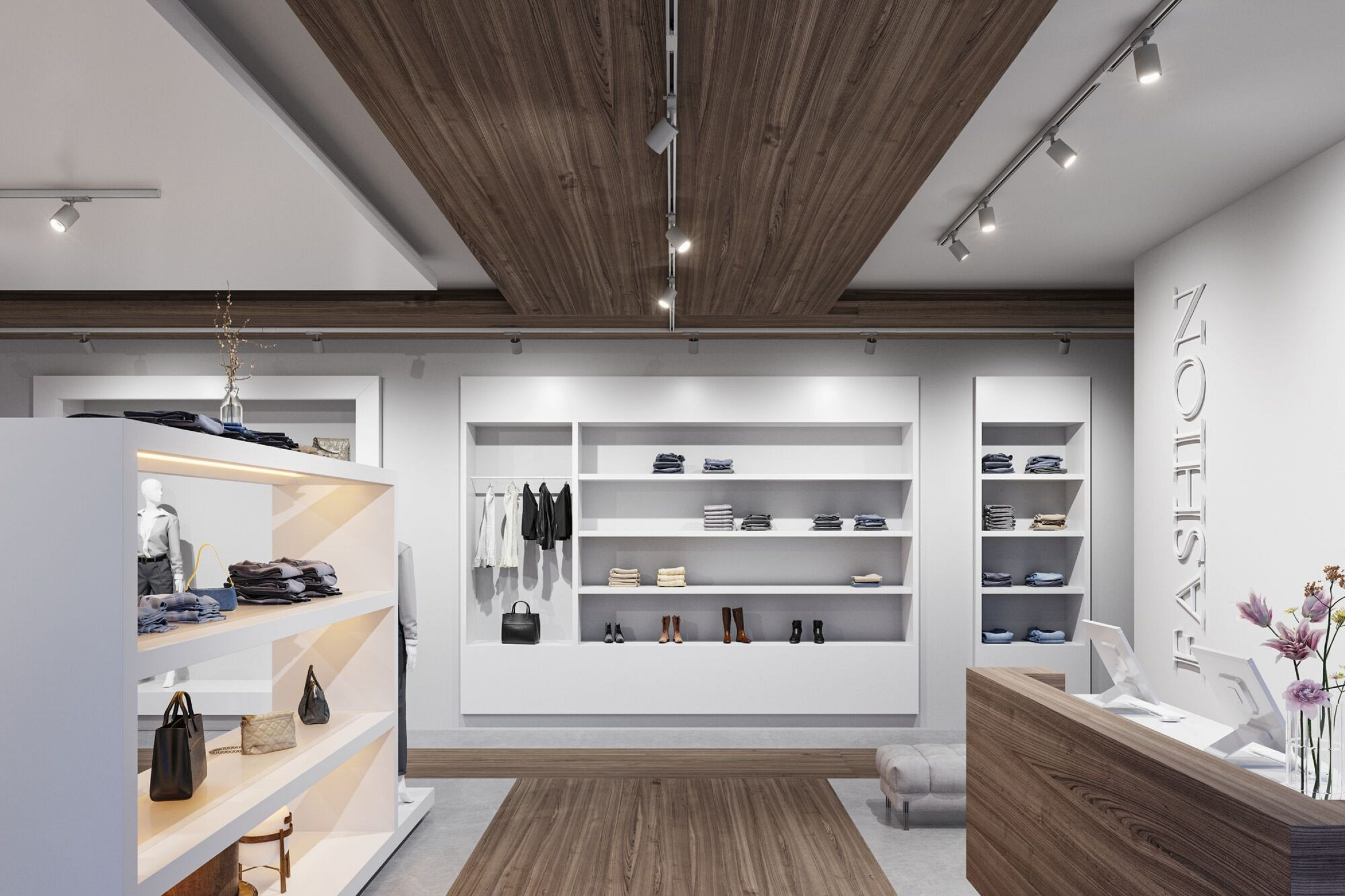 Wnętrze nowoczesnego butiku mody. Ekspozycje odzieży, półki ze złożonymi przedmiotami i drewniany blat. Sufit ma oświetlenie szynowe.