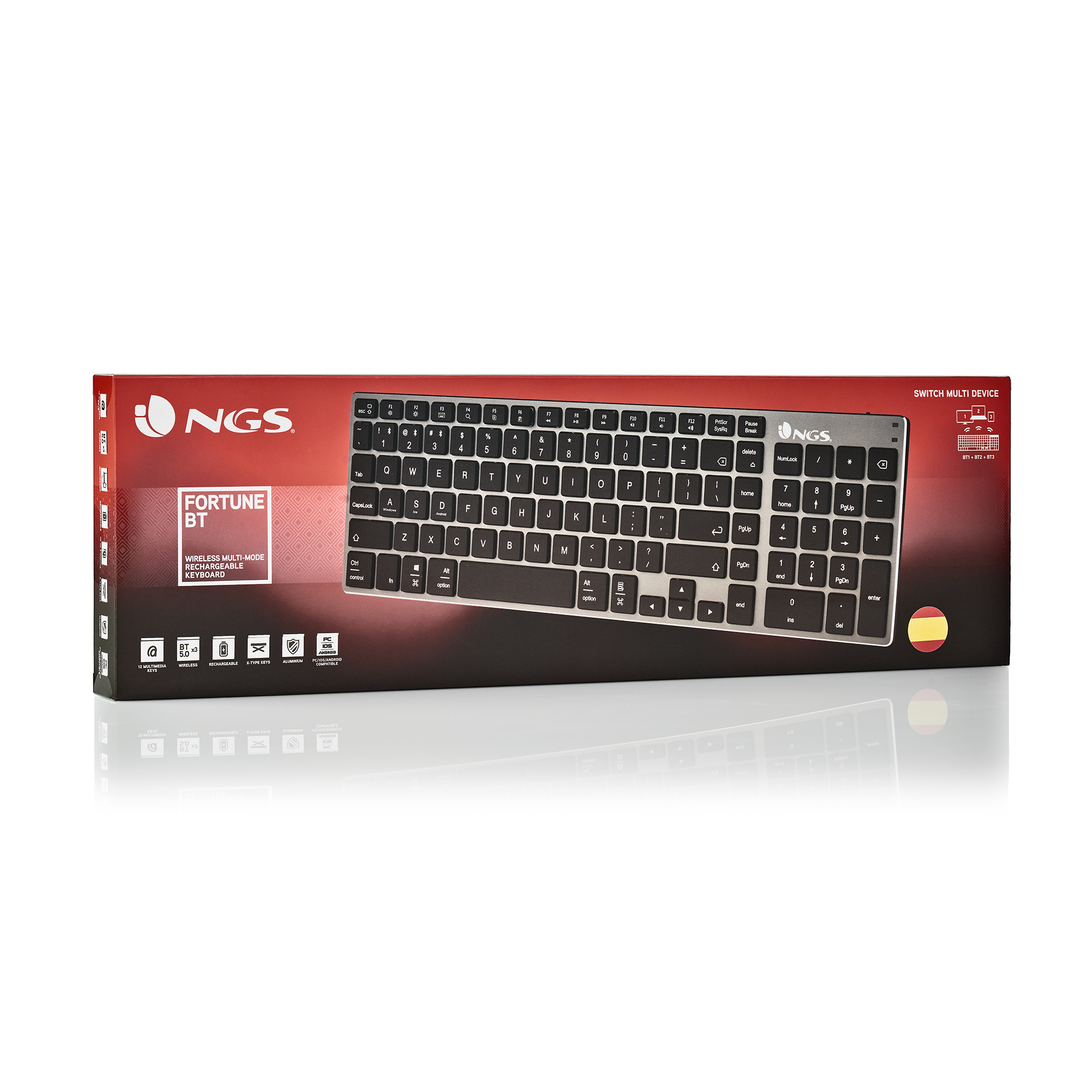 Una caja de teclado con un teclado plateado en el interior. La caja es roja y negra con la marca NGS.