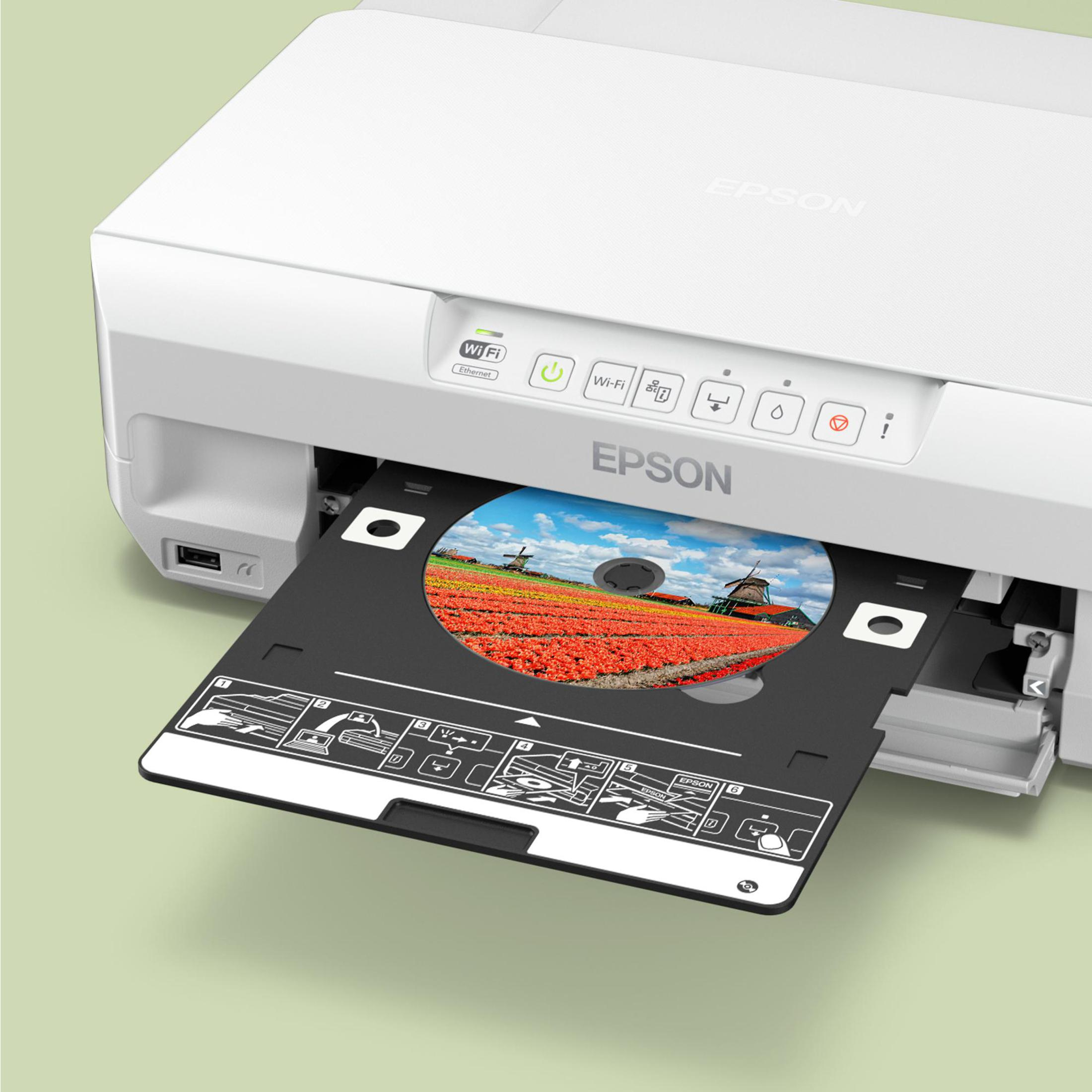 Biała drukarka Epson z otwartą tacą na płyty CD, przedstawiająca pole czerwonych tulipanów i wiatrak.
