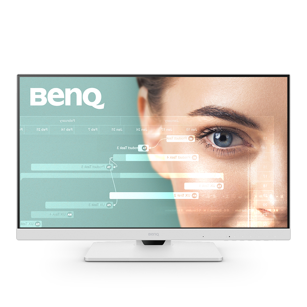 A white BenQ monitor displays a woman's eye with data overlay. The monitor sits on a white stand. The BenQ logo is visible.