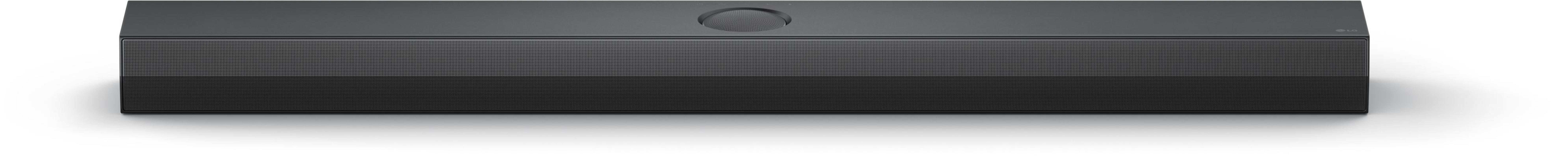 Ciemnoszary soundbar z perforowanym przodem. Ma okrągły głośnik i subtelne logo LG.