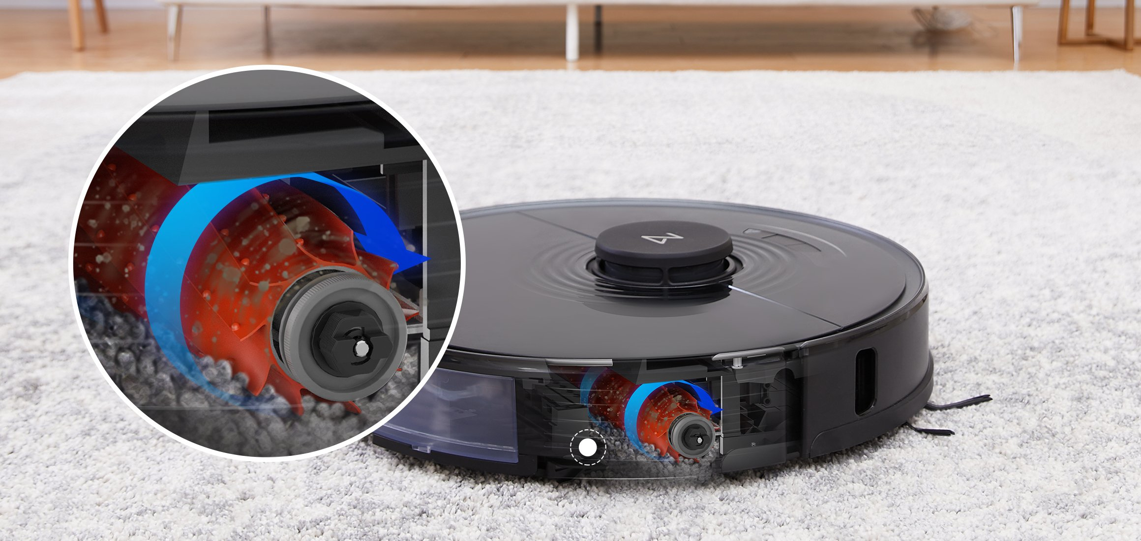 A robotic vacuum cleaner on a carpet. Detail shows the internal parts with a rotating brush and air flow path.