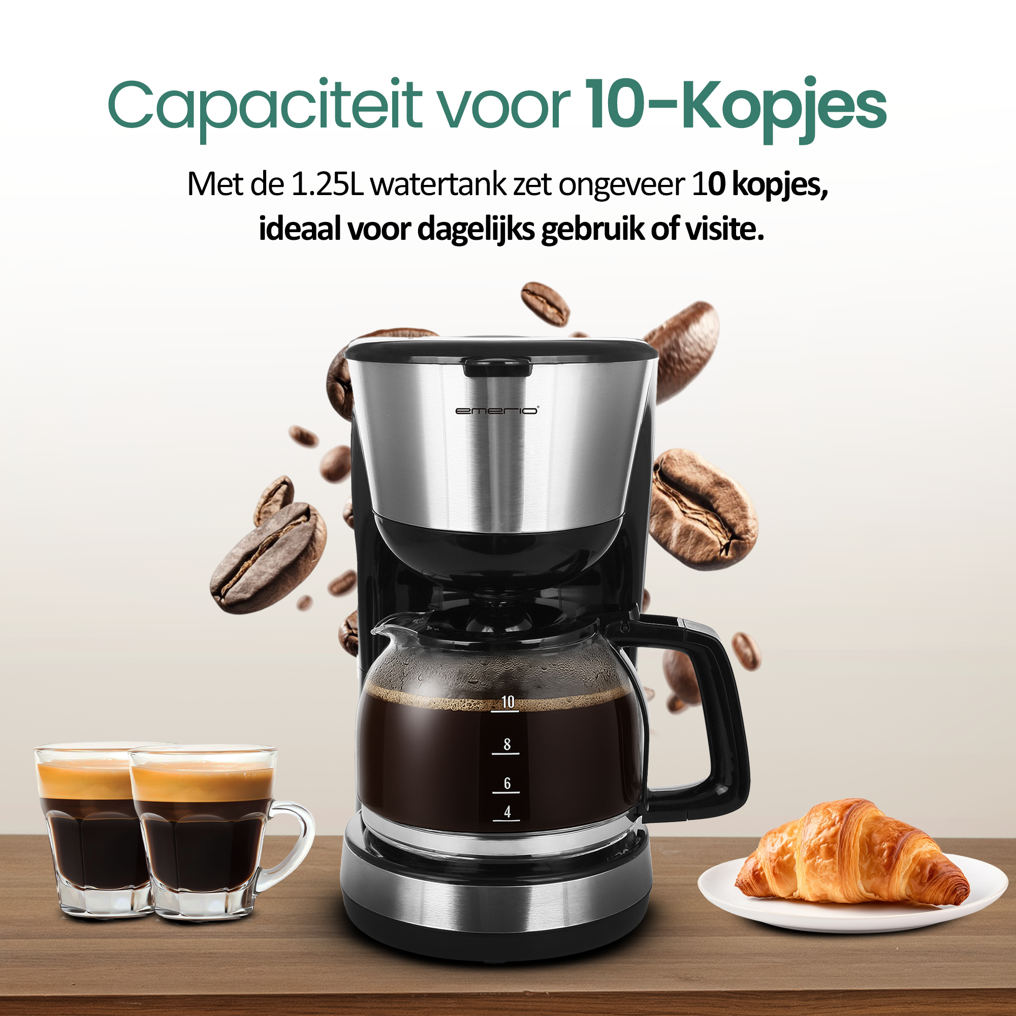 Coffee maker with coffee, two espresso cups, coffee beans, and a croissant on a plate.
