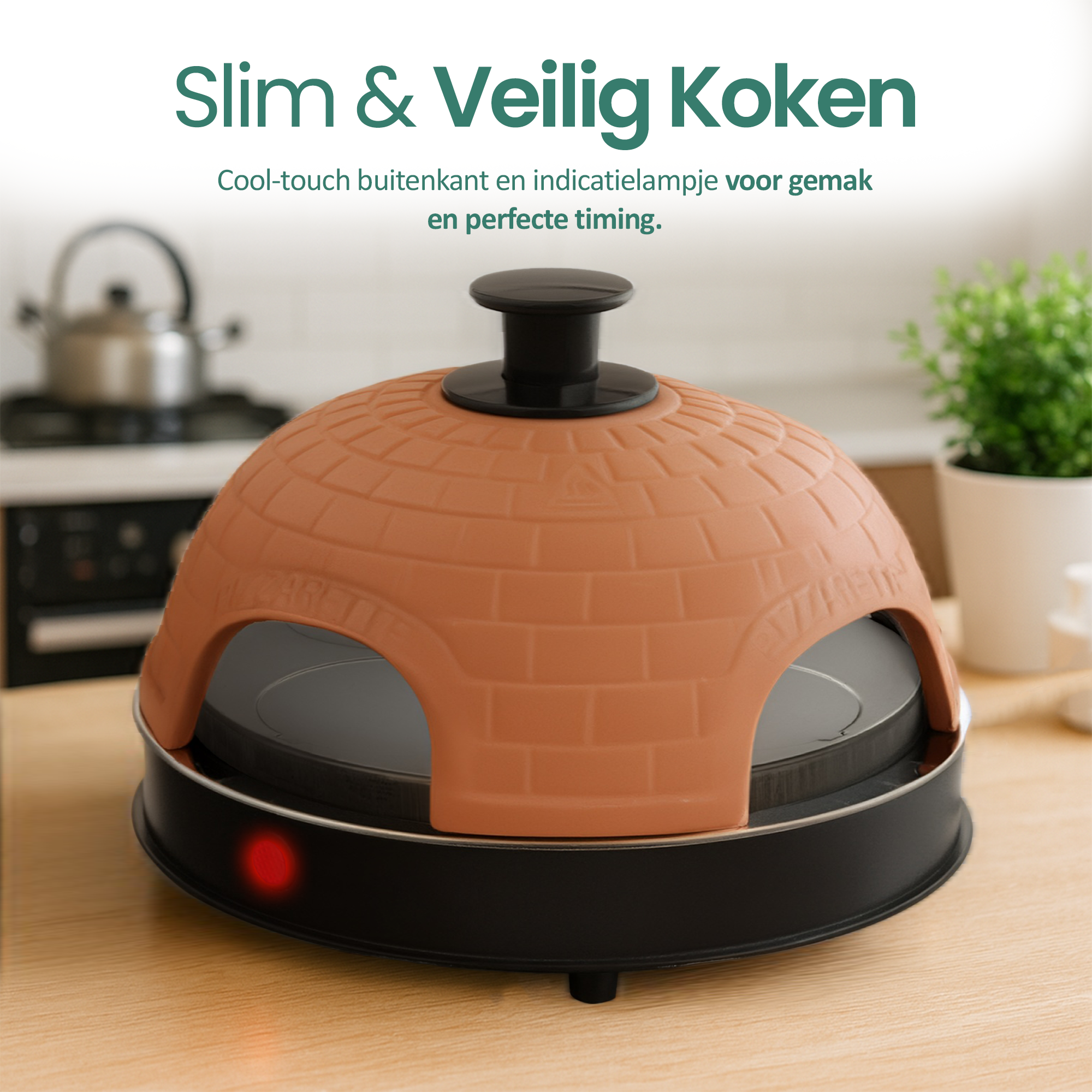 A pizza oven with a brick-like dome is on a wooden surface. A red light indicates it's on, and the background shows a kitchen.