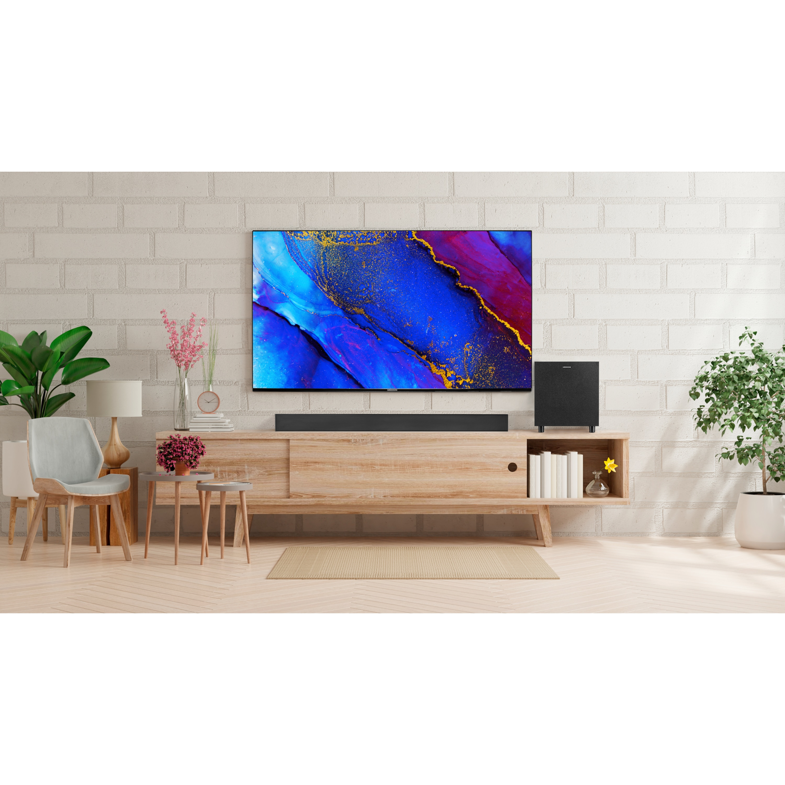 Living room with TV, soundbar, and subwoofer on a wooden cabinet. Plants and a chair are also visible.
