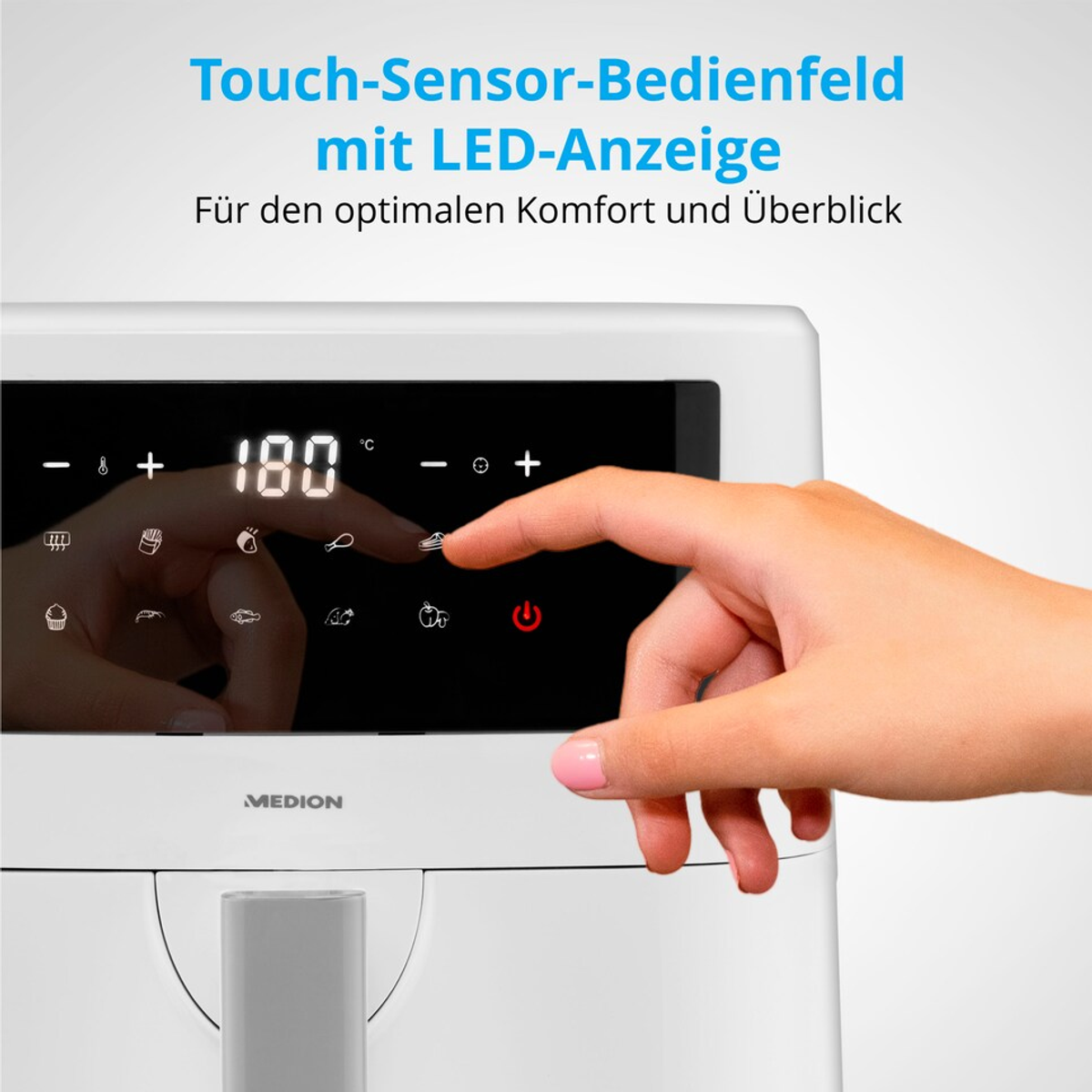 Dłoń dotyka panelu sterowania frytkownicy powietrznej z temperaturą 180 stopni. Nazwa marki MEDION znajduje się na dole.