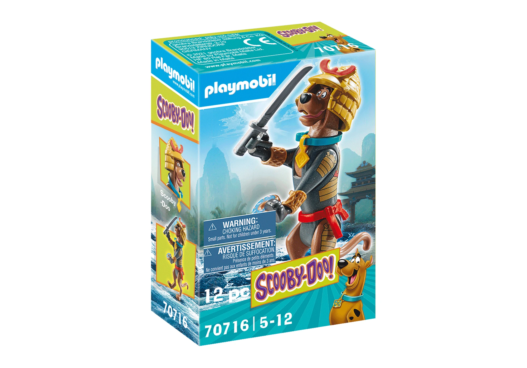 Pudełko Playmobil przedstawia Scooby-Doo jako samuraja, trzymającego miecz. Pudełko zawiera ostrzeżenia i logo Scooby-Doo.