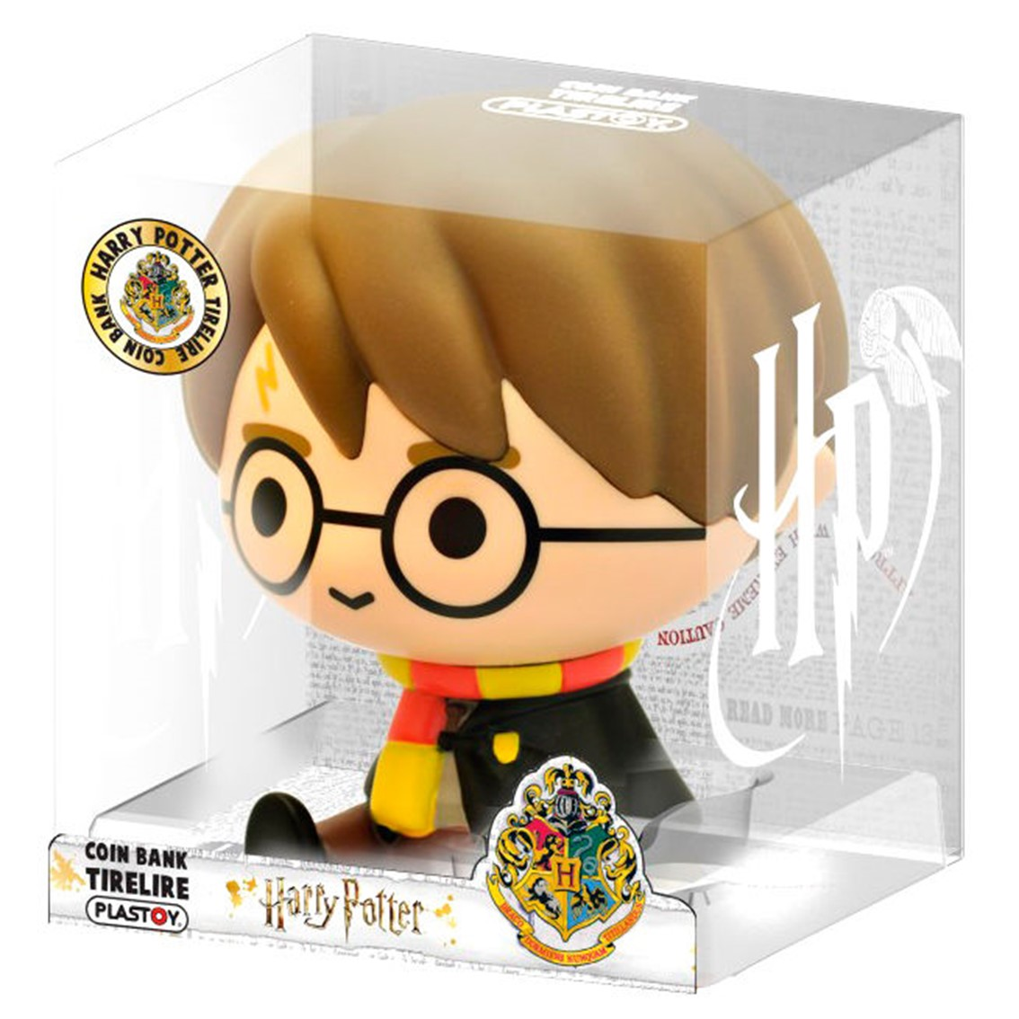 Figura de hucha de Harry Potter dentro de una caja de plástico transparente. Tiene cabello castaño, gafas redondas y una bufanda amarilla y roja.