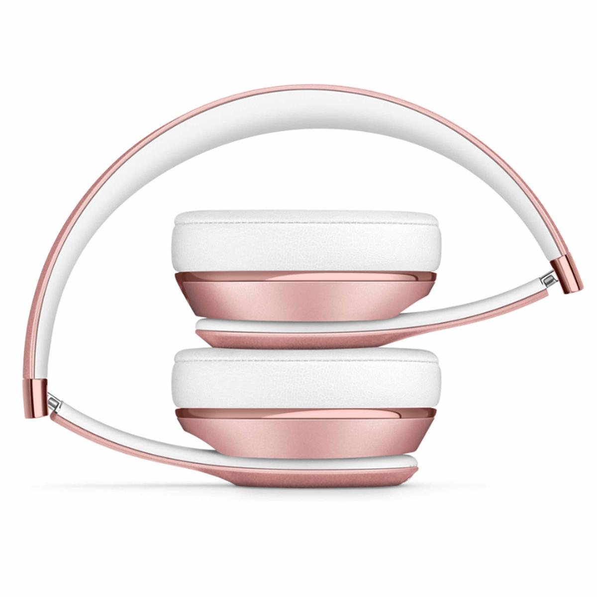 Cuffie oro rosa e bianche piegate, su sfondo bianco. I padiglioni sono bianchi con dettagli oro rosa.