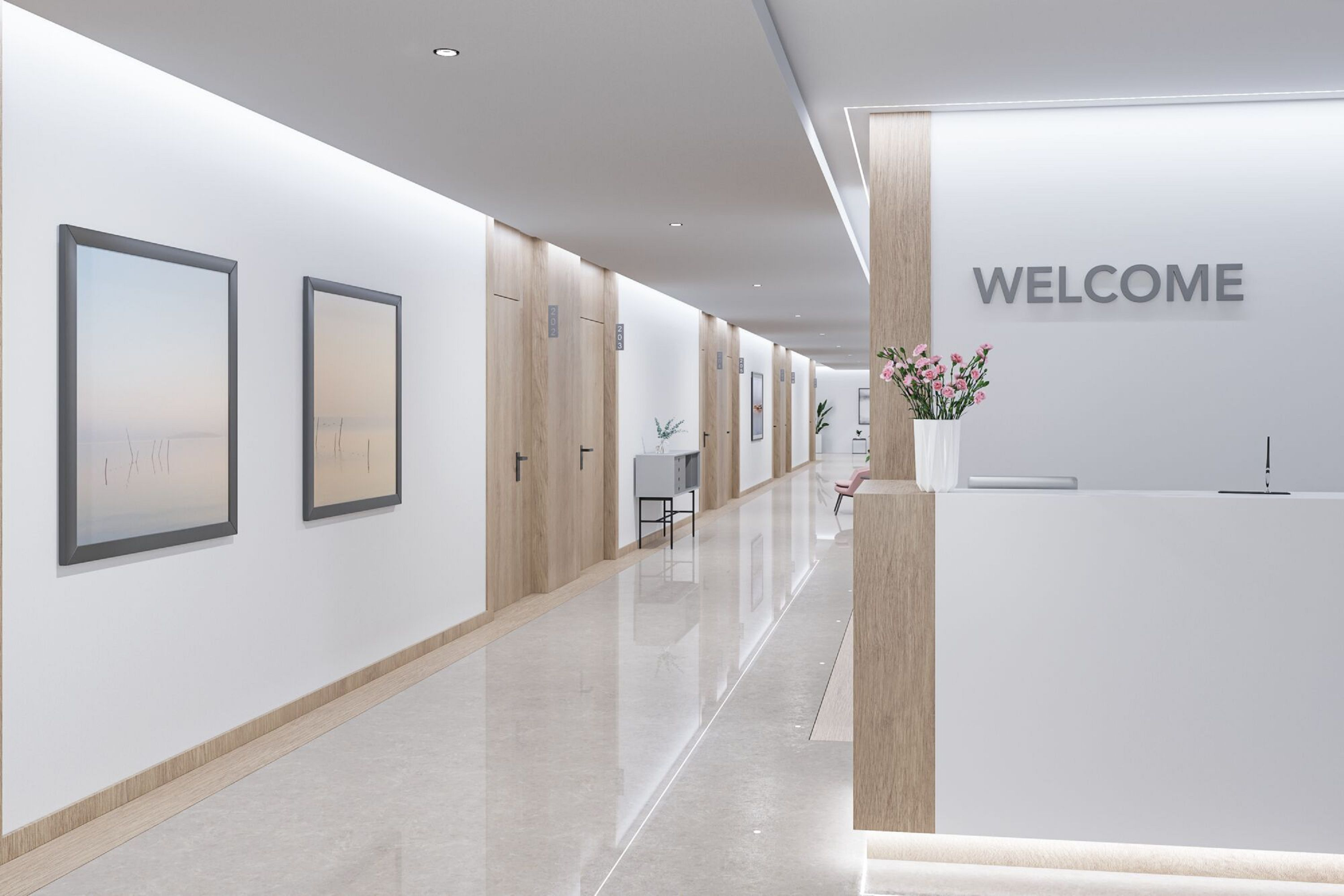 Nowoczesny korytarz z białymi ścianami, drewnianymi drzwiami i recepcją z napisem 'WELCOME'.