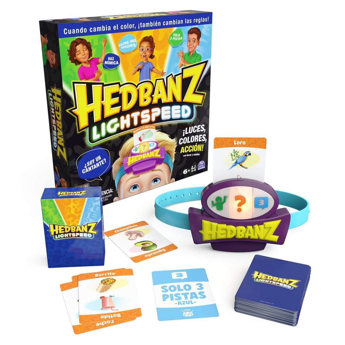 Caja de juego Hedbanz Lightspeed, cartas y diadema. Incluye elementos del juego e ilustraciones. El texto incluye frases en español e instrucciones del juego.