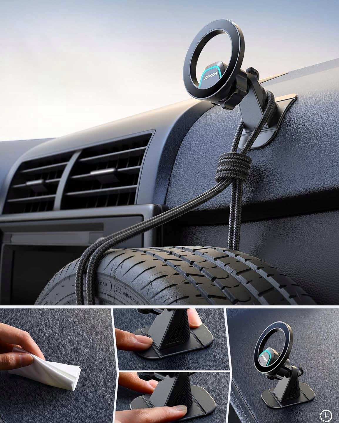 Czarny uchwyt na telefon zamontowany na desce rozdzielczej samochodu. Ma okrągły kształt z nazwą marki Joyroom. W tle widać oponę.