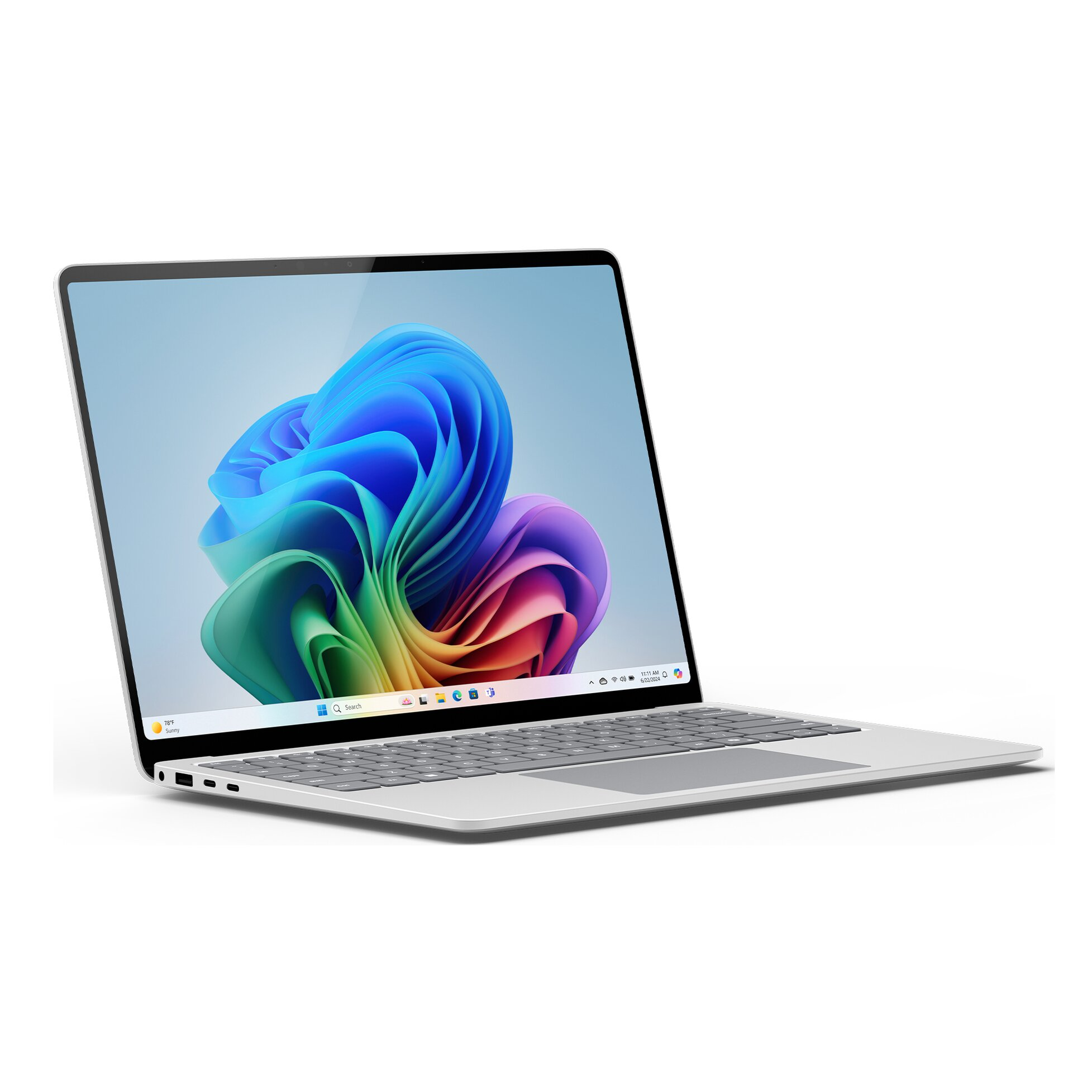 Un laptop argentato mostra un'immagine astratta colorata. La tastiera è grigia. Lo schermo mostra l'interfaccia Windows.