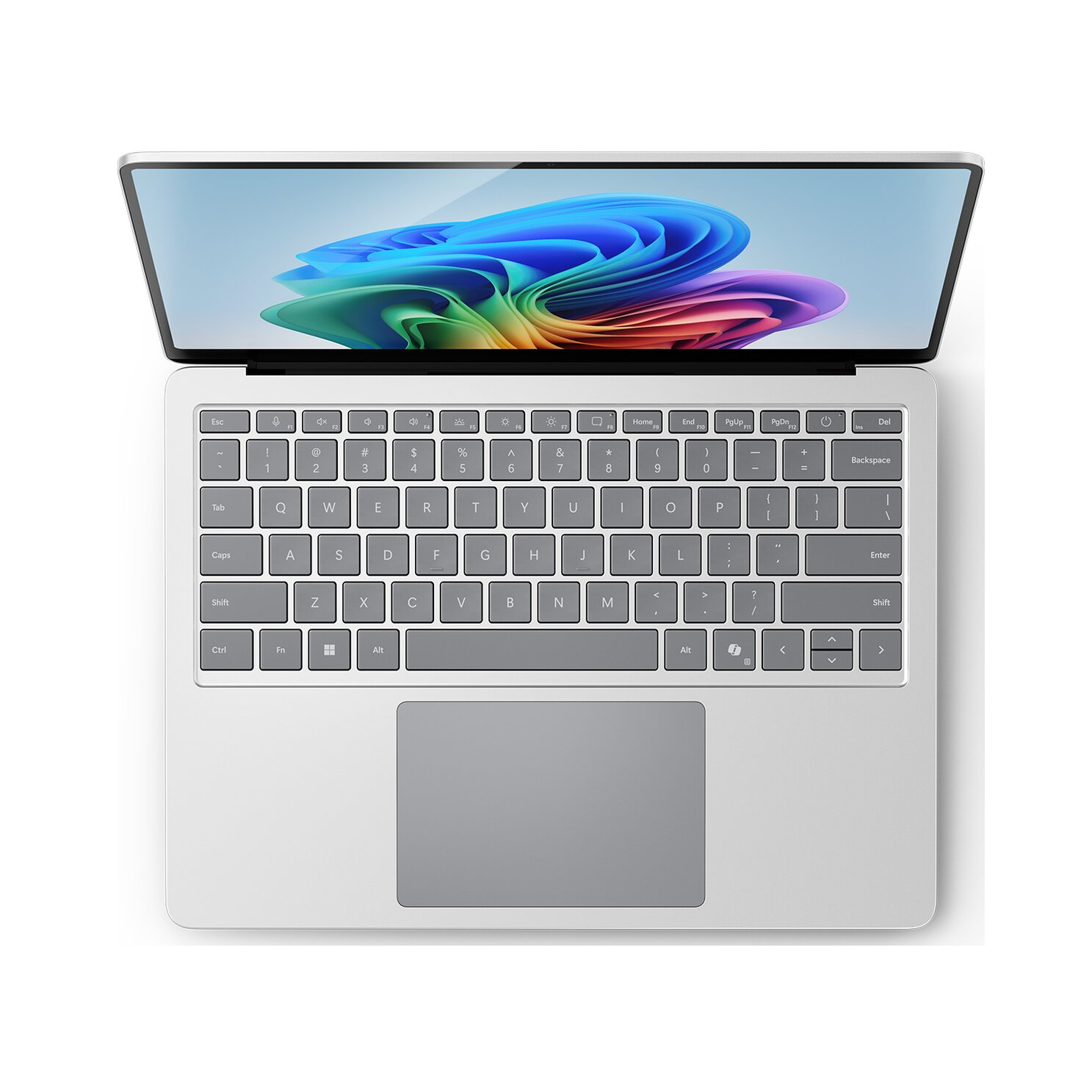 Un laptop argentato è aperto su una superficie bianca. Lo schermo mostra un'immagine astratta colorata. Tastiera e touchpad sono visibili.