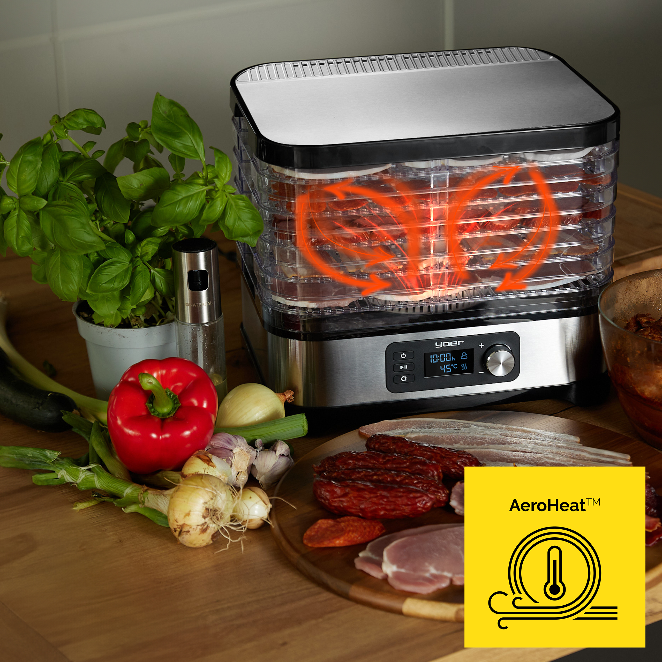 Suszarka do żywności z jedzeniem w środku, warzywa, zioła i mięso na drewnianej powierzchni, z żółtym logo AeroHeat.