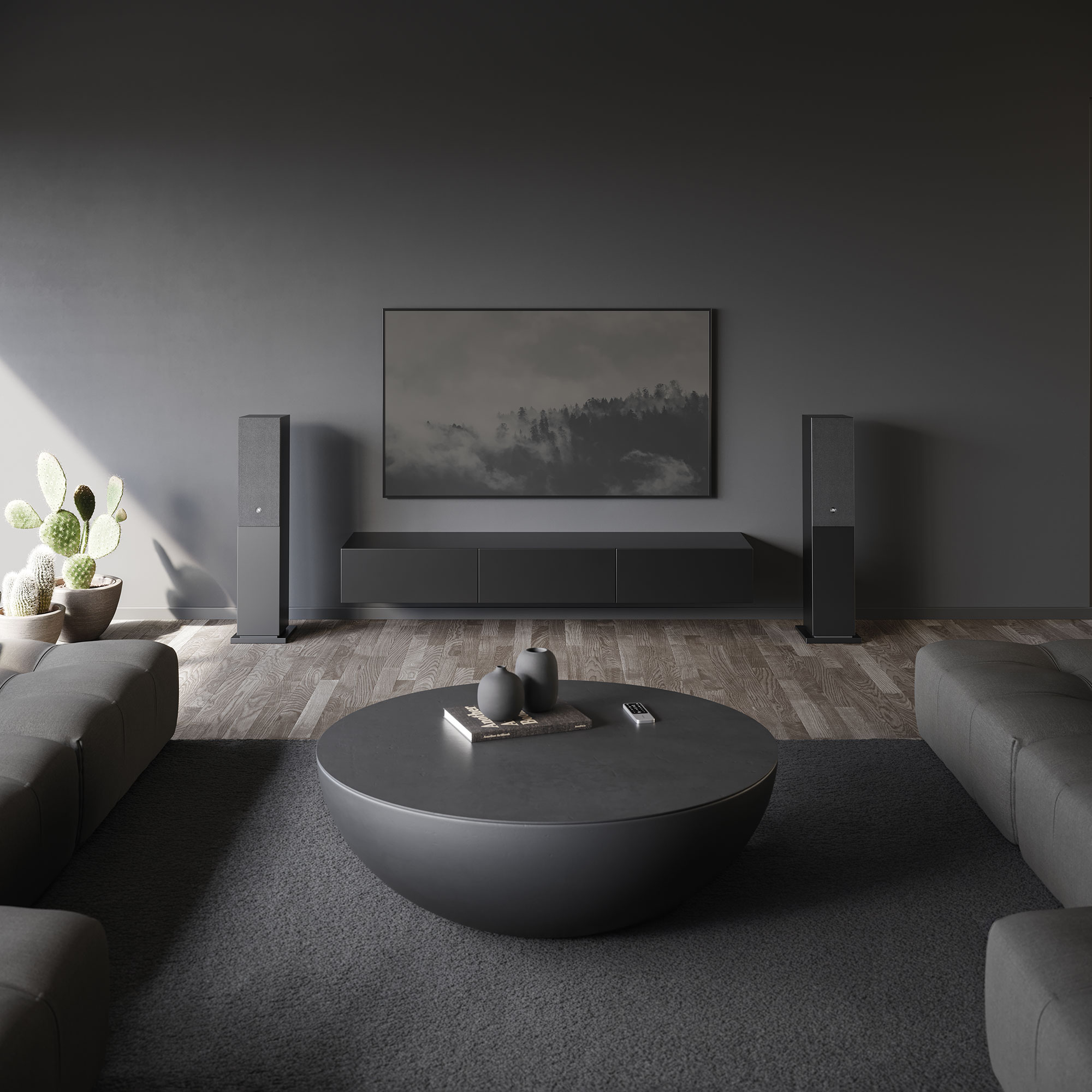 Modernes Wohnzimmer mit dunkelgrauen Wänden, Möbeln und einem runden Couchtisch. Ein Fernseher ist an der Wand befestigt.