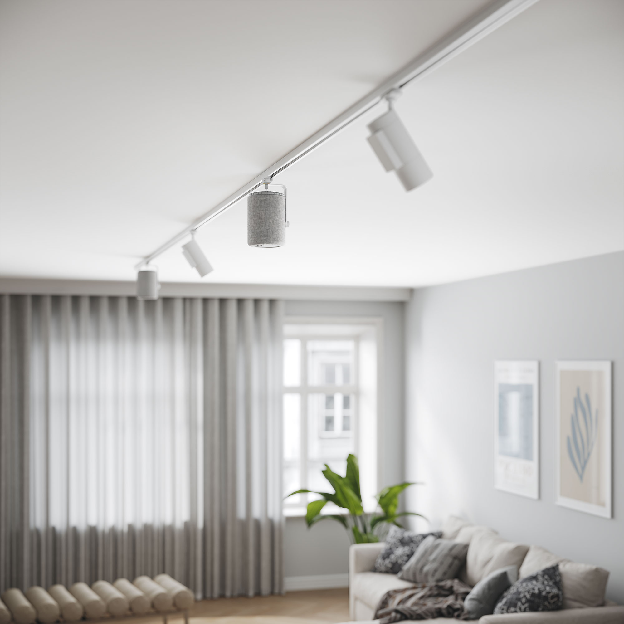 Ein modernes Wohnzimmer mit Schienenbeleuchtung. Ein Sofa, Vorhänge und ein Fenster sind sichtbar. Eine Pflanze und zwei gerahmte Bilder sind vorhanden.