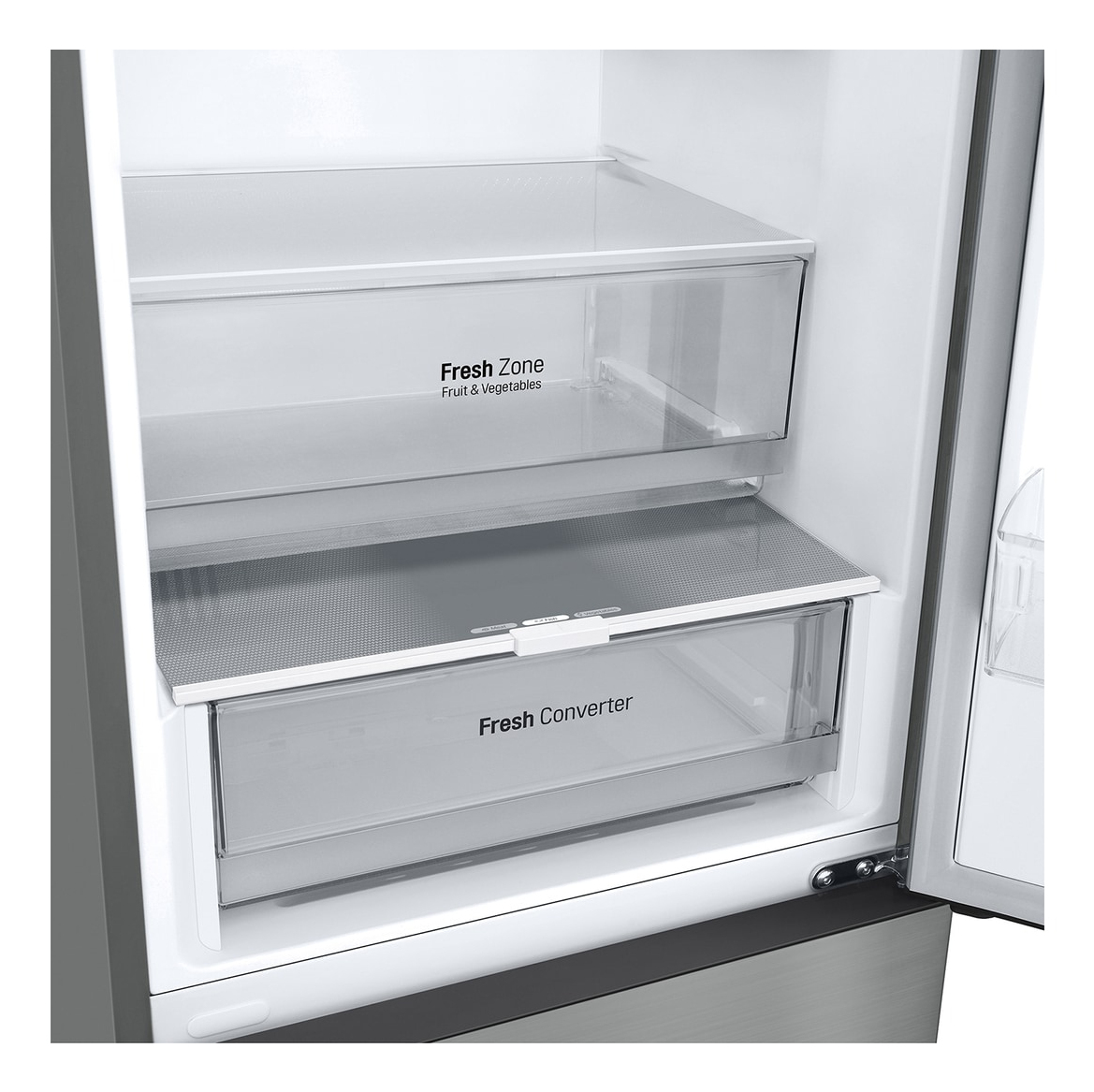Dentro de un refrigerador, se ven dos cajones transparentes etiquetados como 'Fresh Zone' y 'Fresh Converter'. La puerta del refrigerador está abierta.