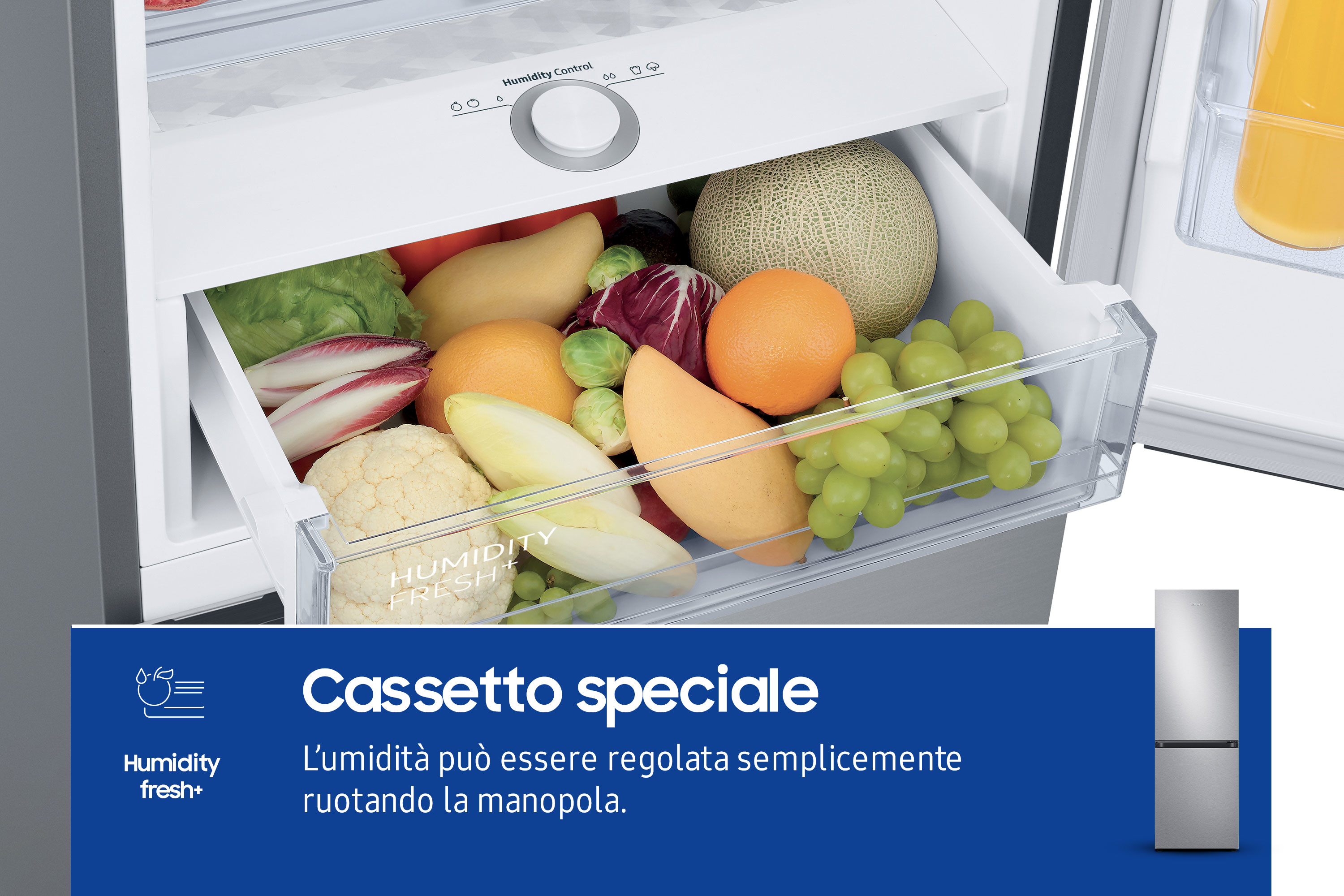 All'interno di un cassetto del frigorifero ci sono frutta e verdura: uva, arancia, melone, cavolfiore e altro. Controllo dell'umidità sopra.