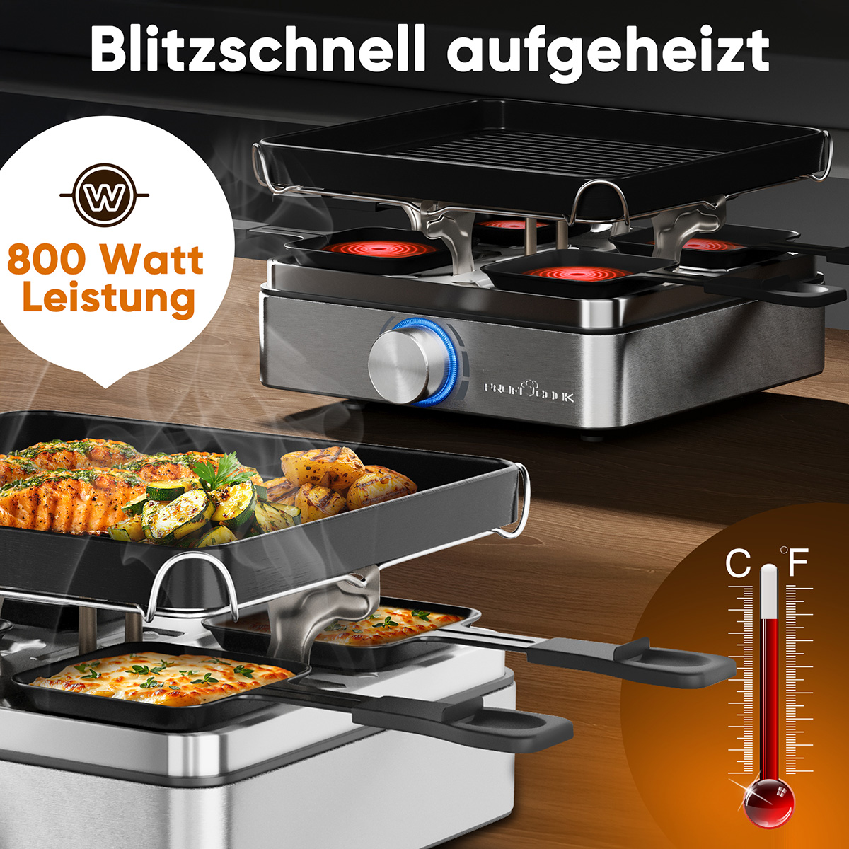 Ein Raclette-Grill mit Essen, das gekocht wird. Lachs, Zucchini und Kartoffeln befinden sich in den Schalen. Ein Thermometer wird angezeigt.